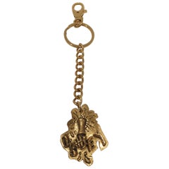 Obey gold tone key chain / accessories