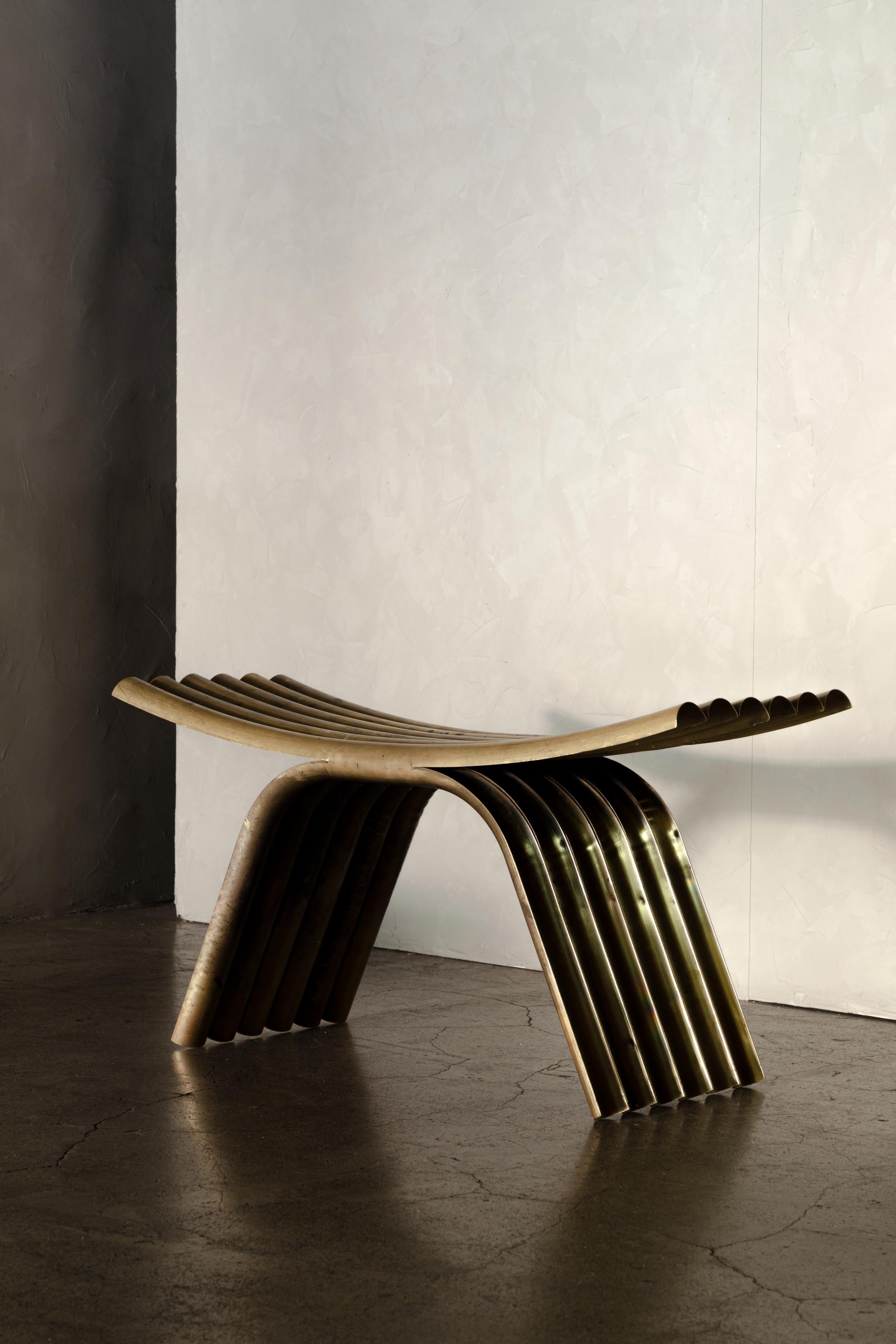 OBJ-02 stool by Manu Bano
Dimensions: W 90 x D 35 x H 45 cm
Material: Brass.

MANU BAÑÓ WAS BORN IN VALENCIA, SPAIN IN 1990. AFTER STUDYING INDUSTRIAL DESIGN AT UCH CEU UNIVERSITY IN VALENCIA AND A MASTER’S DEGREE IN FURNITURE AND LIGHTING, HE