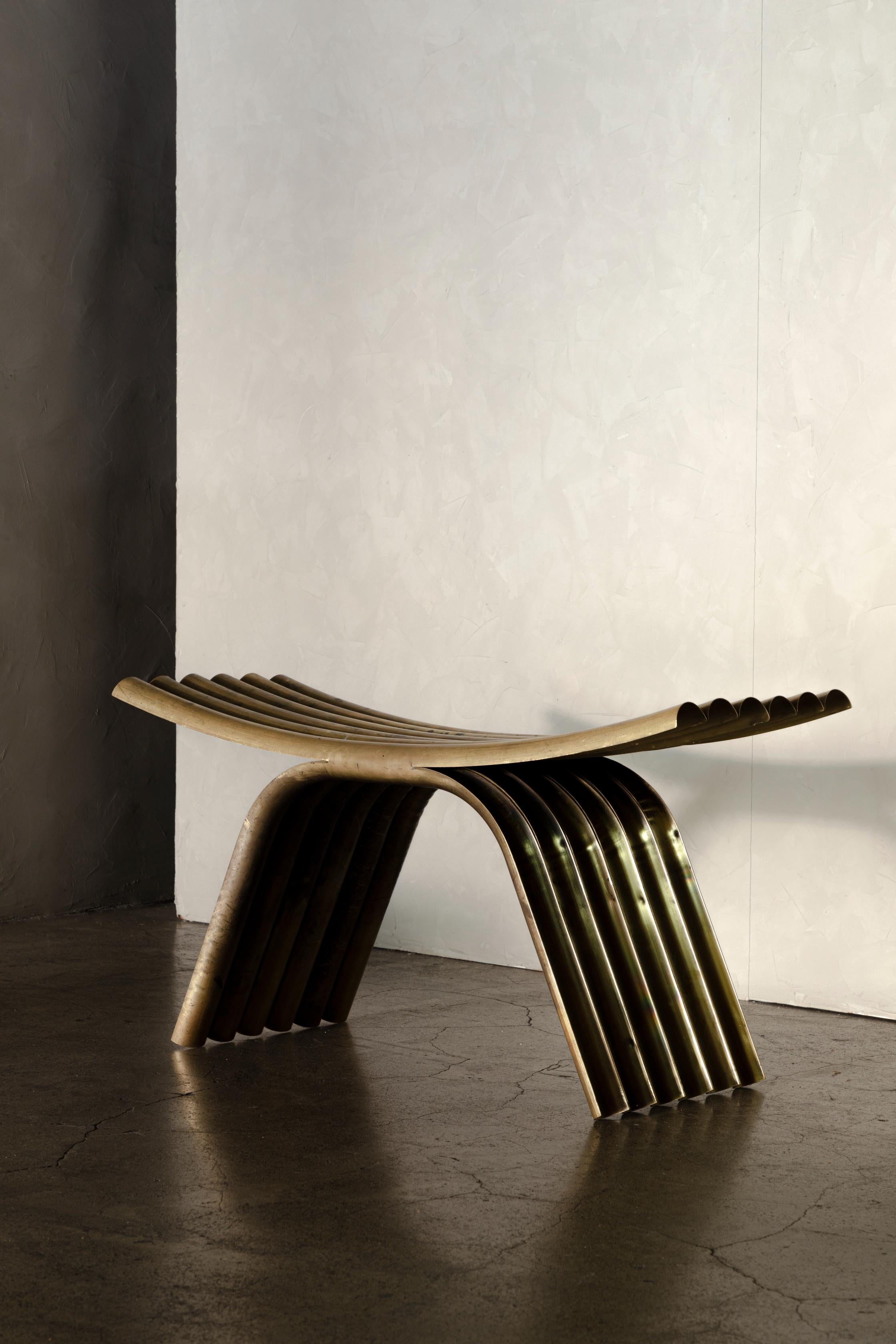 OBJ-02 stool by Manu Bano
Dimensions: W 90 x D 35 x H 45 cm
Material: Brass.

MANU BAÑÓ WAS BORN IN VALENCIA, SPAIN IN 1990. AFTER STUDYING Industrial Design AT UCH CEU UNIVERSITY IN VALENCIA AND A MASTER’S DEGREE IN FURNITURE AND LIGHTING, HE