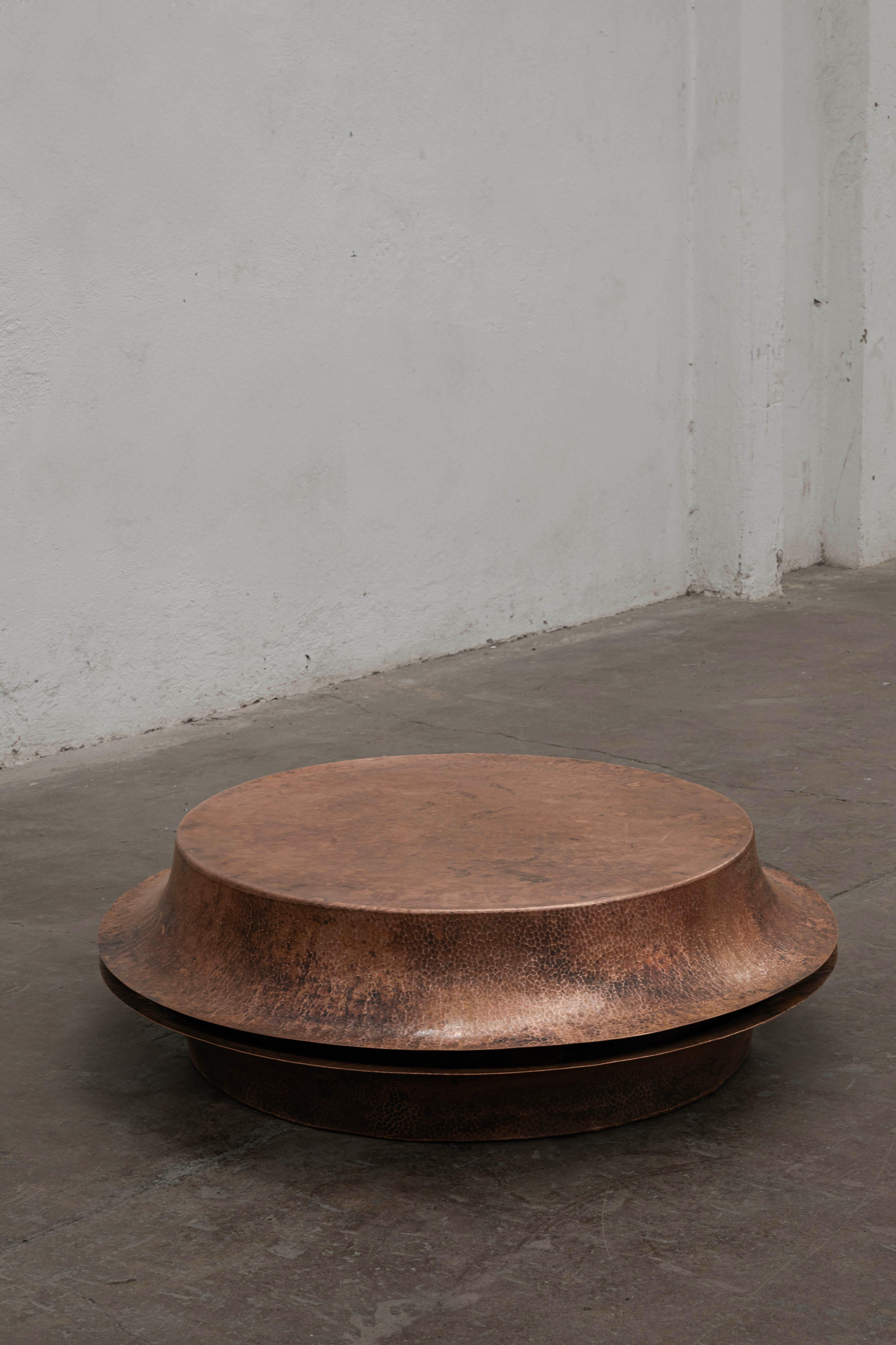 OBJ-06 Medium Copper Coffee Table by Manu Bano
Dimensions: D 110 x W 110 x H 38 cm.
Materials: Hammered copper.

Manu Bañó was born in Valencia, Spain in 1990. After studying industrial design at Uch Ceu University in Valencia and a master’s degree