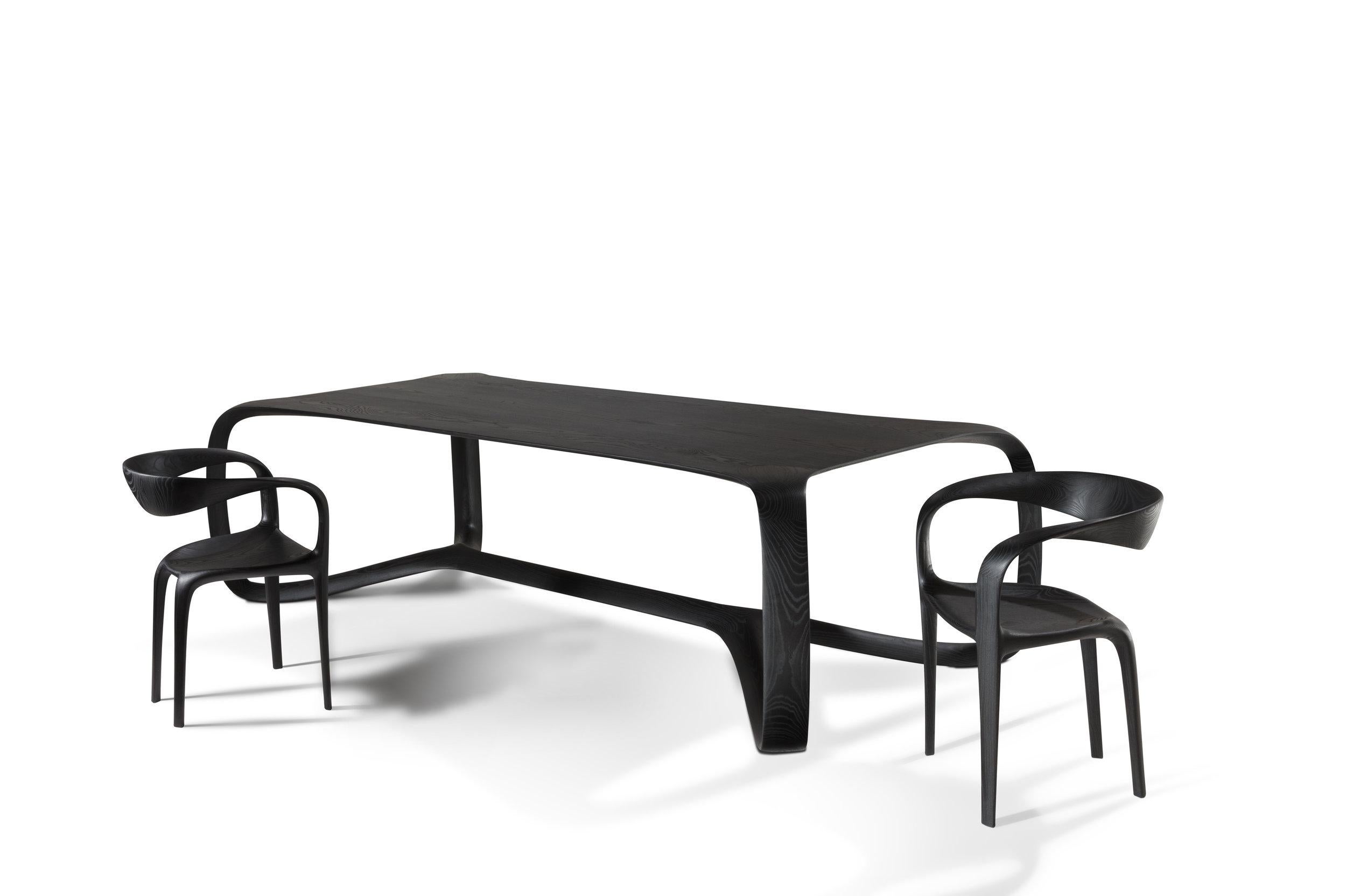 Curved dining chair in curved ebonized ash, designed by Thomas Vaughan for Object Studio. 

Commissioned for SALON A&D in 2018, we have the pair shown in the 1stdibs Gallery in Manhattan.
 