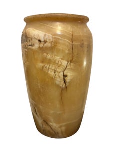 Oblong body, flat discoidal base, rimmed lip and edge, Egypt, Late Period.