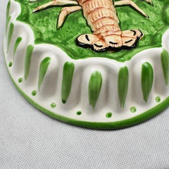 Appendiabiti decorativo oblungo in ceramica con stampo aragosta in verde e arancione