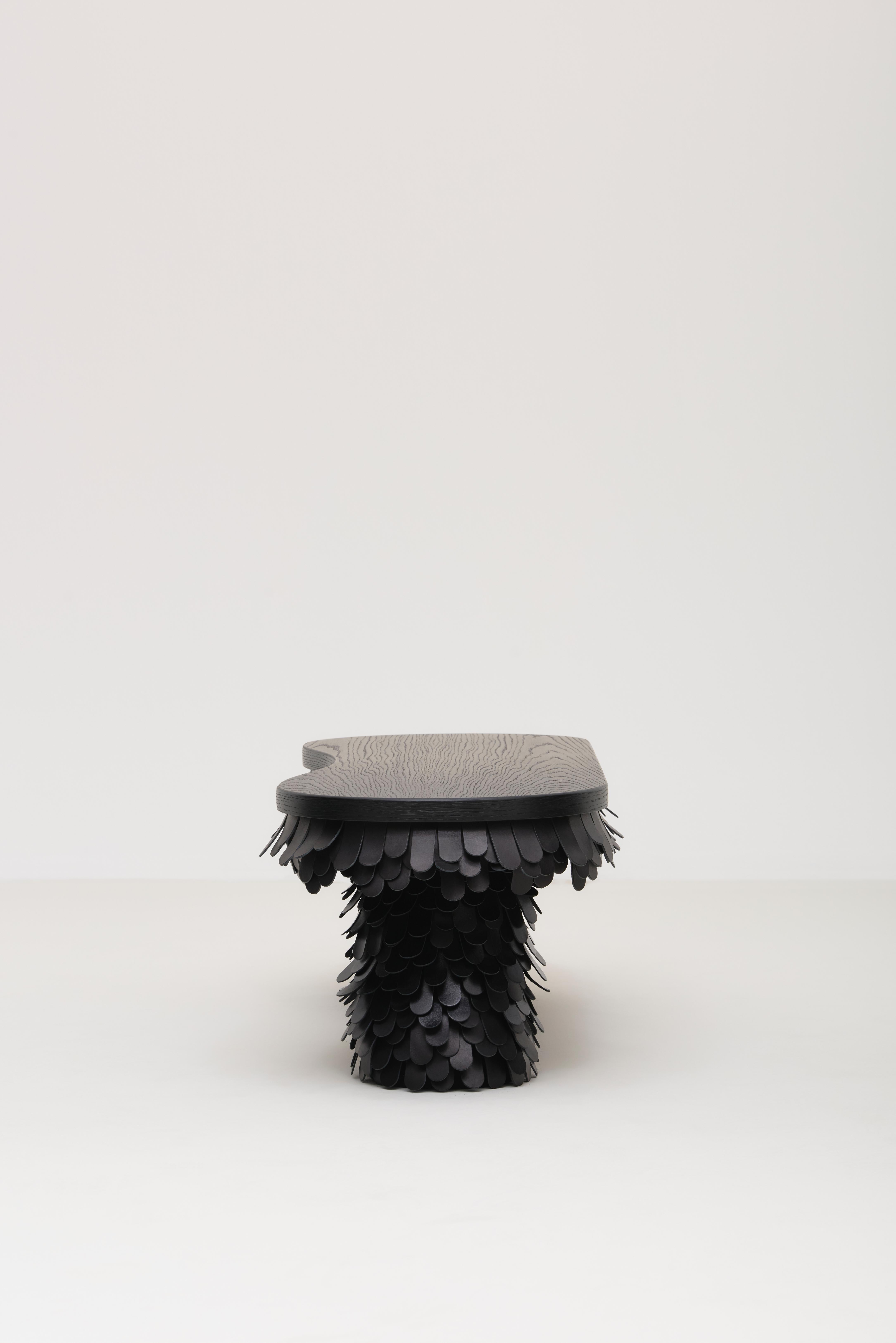 The Betsy Bench designed by Lara Bohinc for Uniqka balances traditional craftsmanship with contemporary aesthetics. The bold sculptural and voluminous forms combine intricate leatherwork to create a harmonious fusion of texture and structure