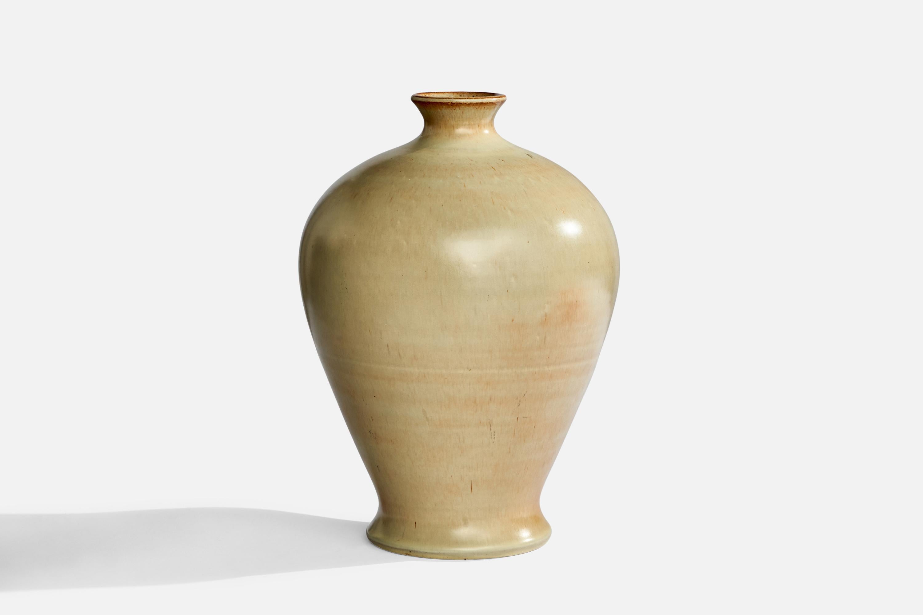 A beige-glazed ceramic vase designed and produced by Obo Malmö, Sweden, 1940s.