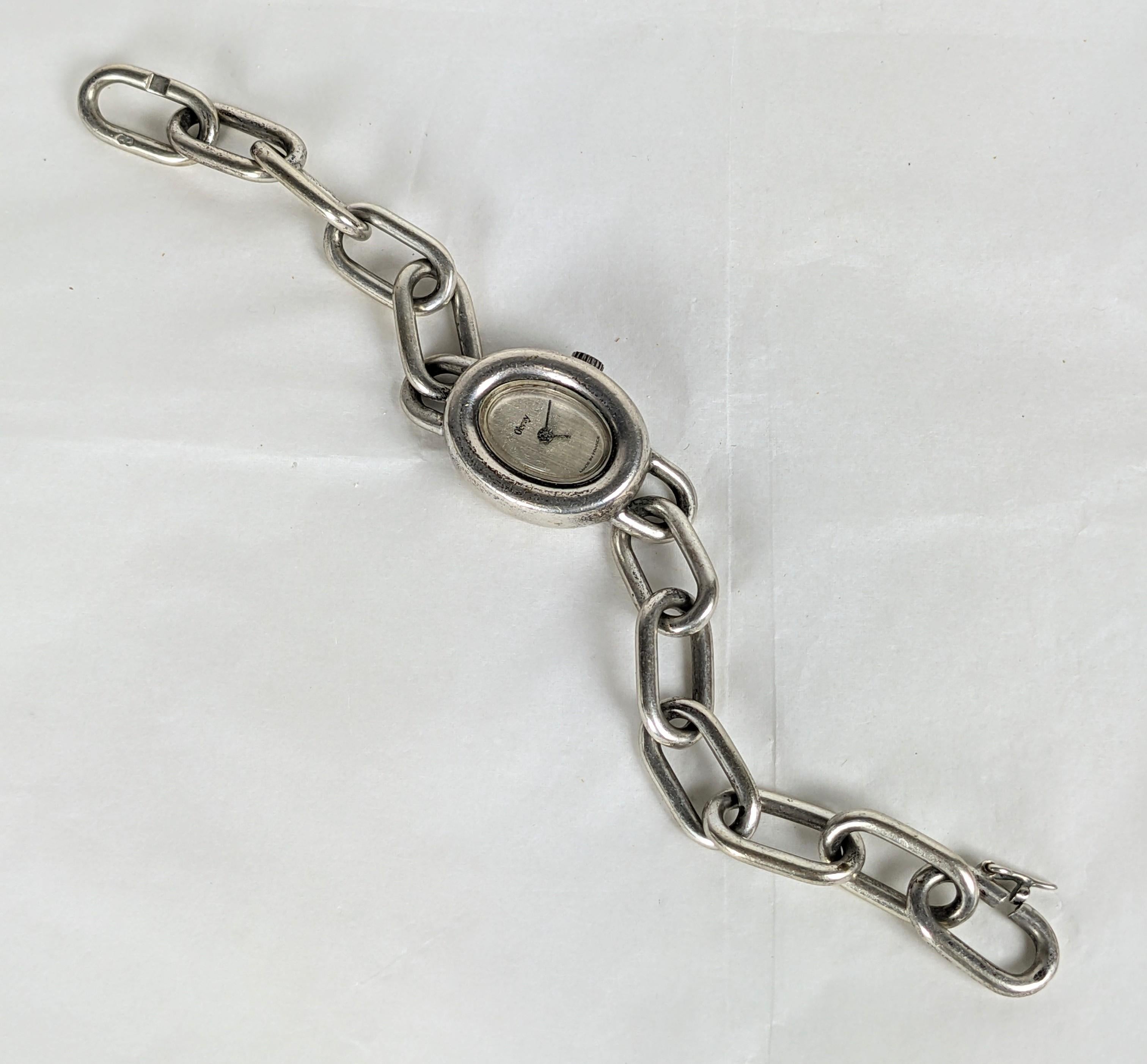 Elegante pulsera reloj de plata Obrey Paris de los años 80. Pesada cadena de eslabones de plata con movimiento clásico de cuerda manual ovalada. Fabricación de plata de calidad Hermes, muy pesada. Marcado como Plata Vendida, por lo que su grado es