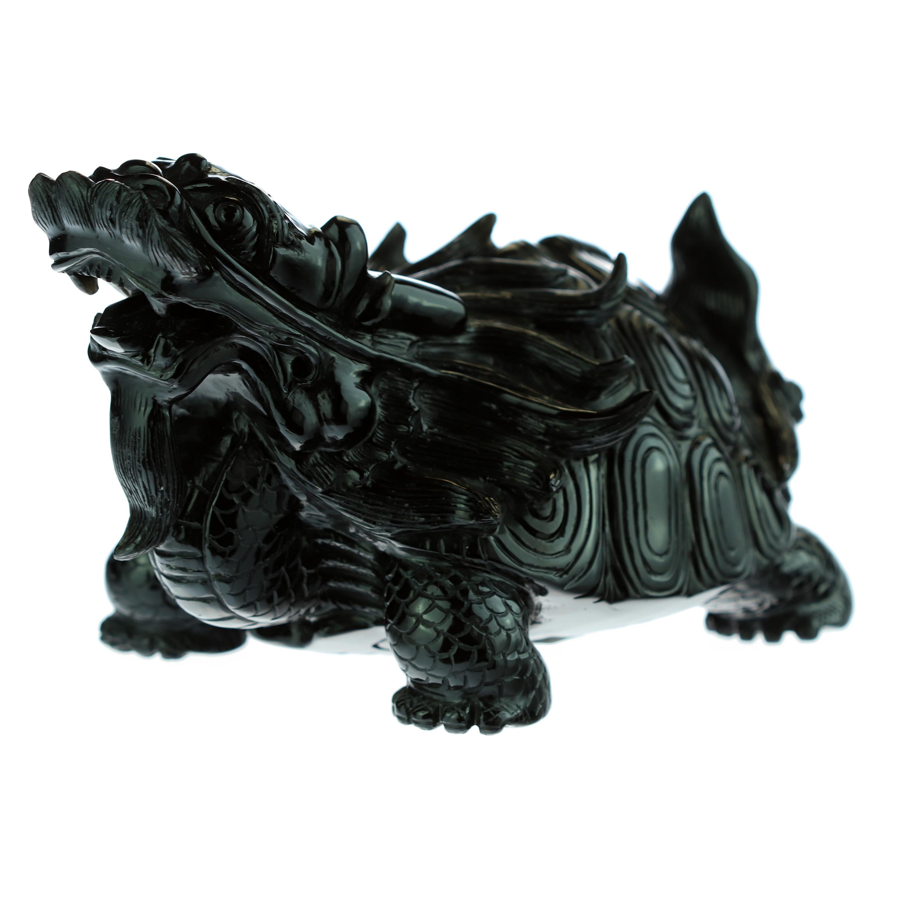 A marvelous mythological sculpture in obsidian. Chinese art, a turtle dragon creature that combines two of the four celestial animals. It had the body of a turtle and a dragon head. It symbolized courage, determination, fertility, longevity, power,