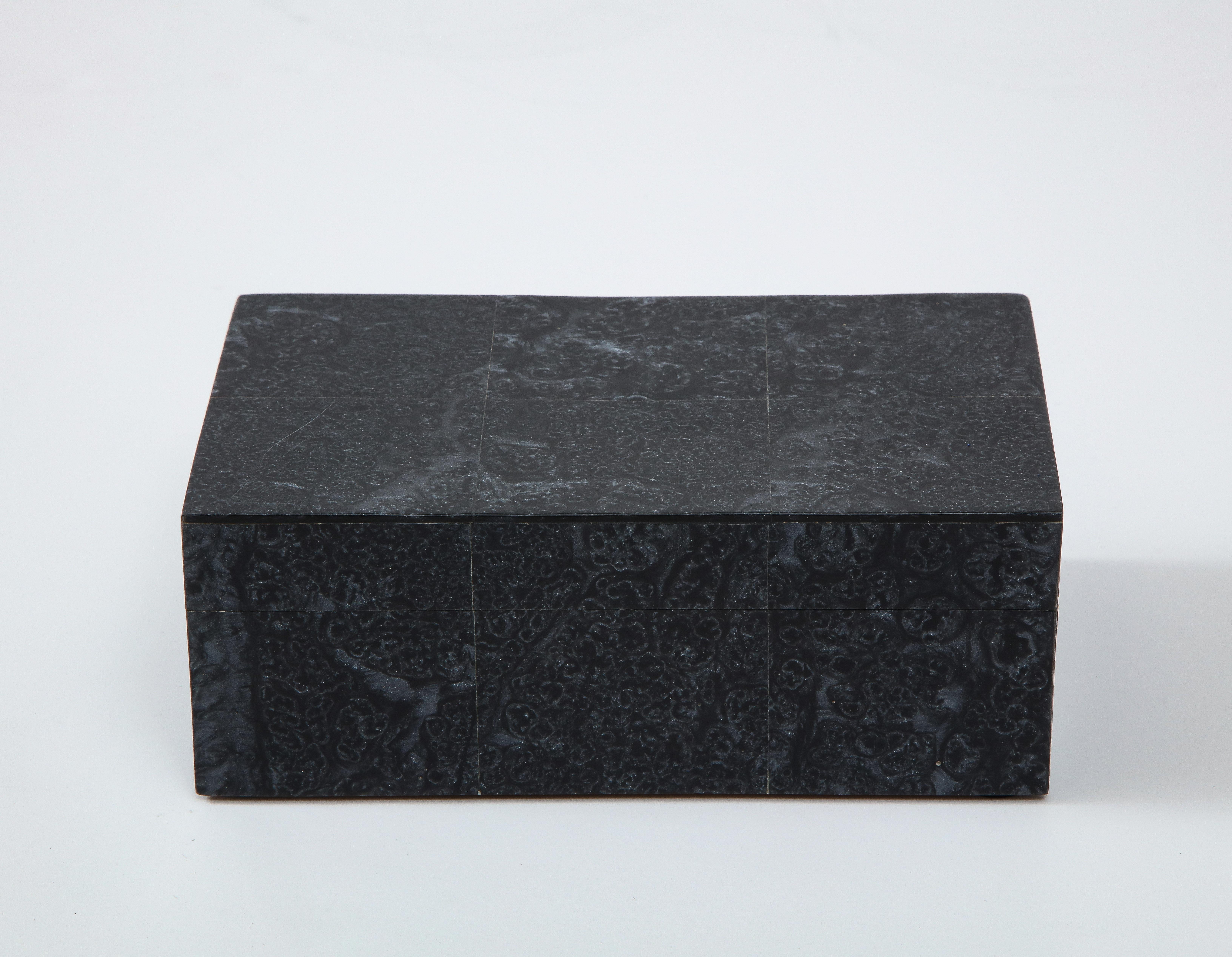 Decorative keepsake box clad in obsidian stone, lined in wood. A great addition to any desk or dresser.