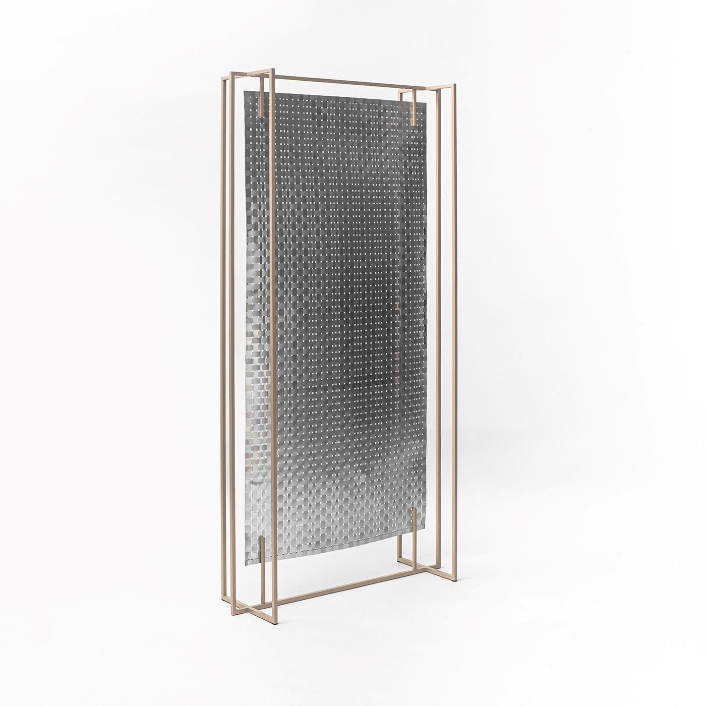 This dual-purpose floor panel can be placed in the middle of a space as a room divider, as well as being placed against the wall as a decorative backdrop. Its handwoven canvas includes aluminum foil, which gives one side a lustrous, reflective