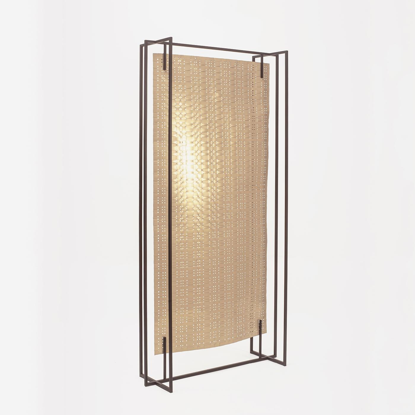 This contemporary screen is perfectly suited for dividing a large, loft-style interior, separating a private corner in a bedroom, or even creating a dynamic backdrop for a bare wall. An open, geometric frame in black-painted tubular iron showcases
