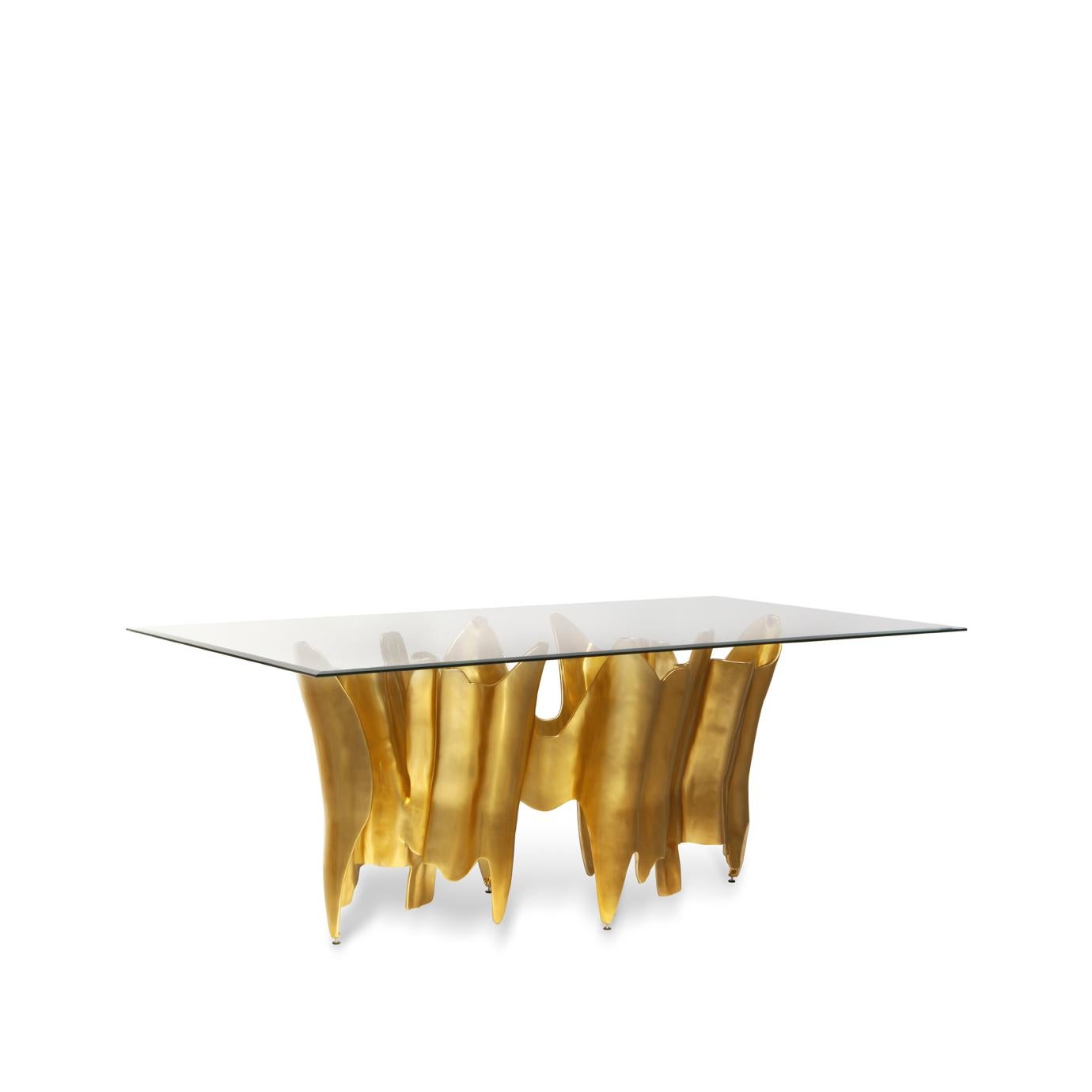 Initially it is a dining table. Then it becomes a dining table cut from clear glass. Your eyes begin to wander down, drinking in the rhythmic design of the aluminum base, following every crevice leading down only to head back up; compelling you to