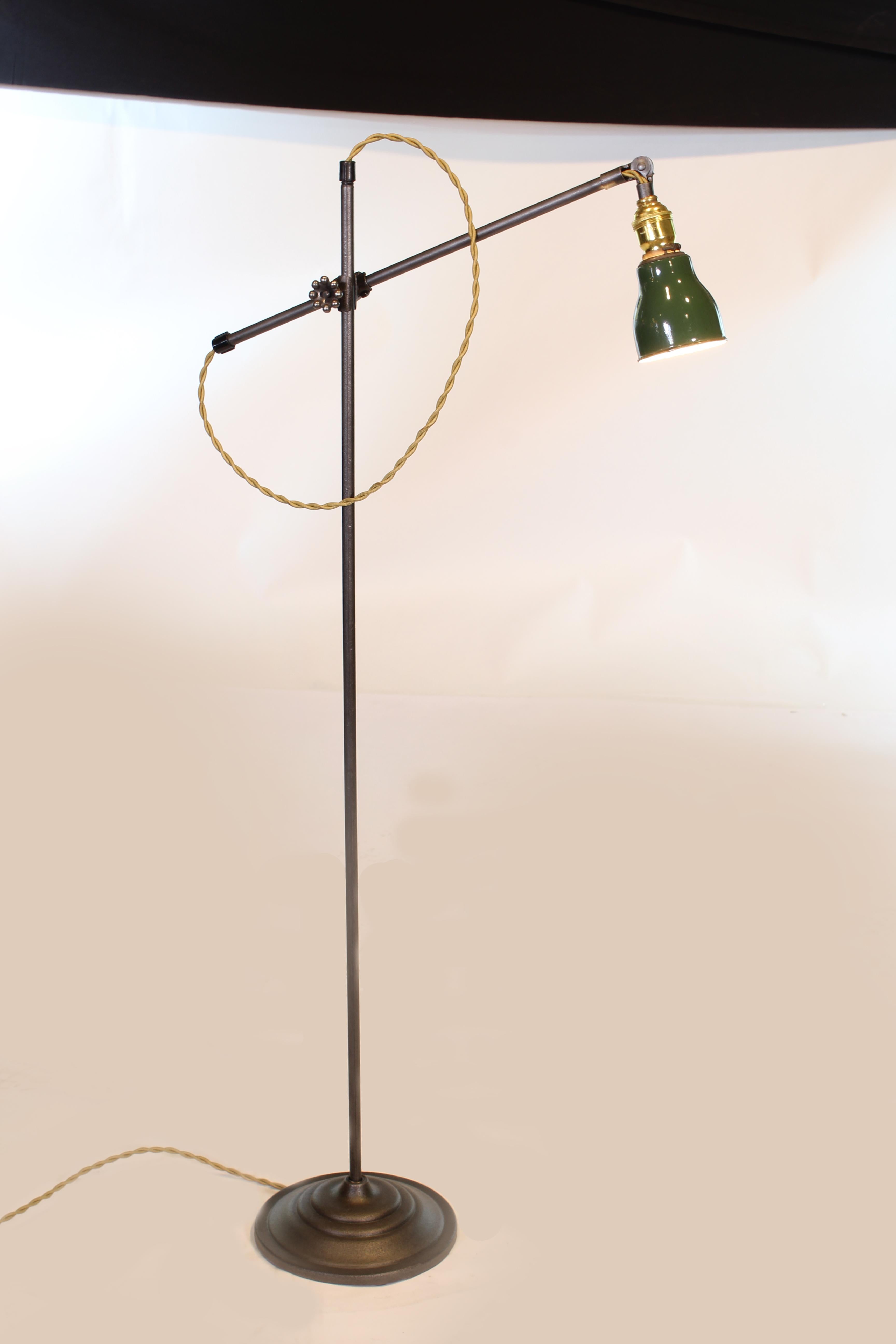 OC white adjustable floor / reading / task lamp with cast iron base and green shade. Base measures 9