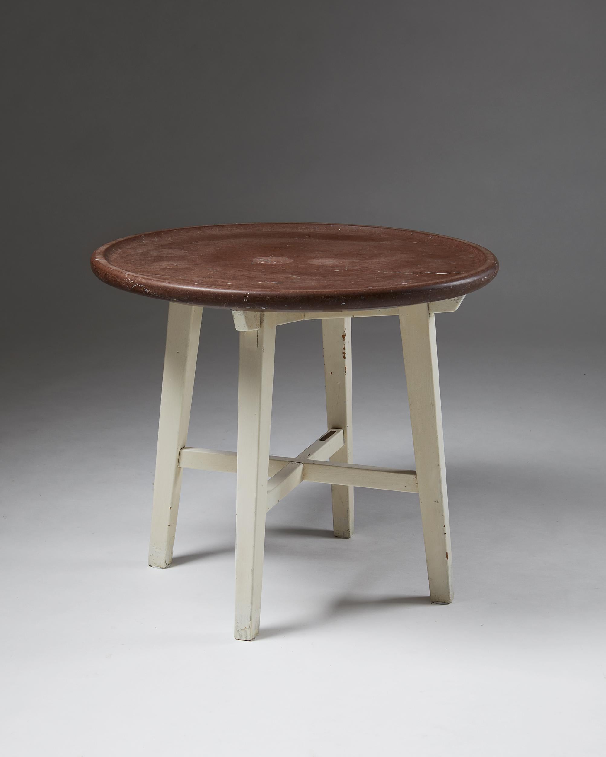 Occasional table, anonymous, Nordiska Kompaniet,
Sweden, 1950s.
Swedish limestone top and lacquered wooden base.

Stamped NK.

Measures: H 61 cm/ 2'
D 70 cm/ 2' 4