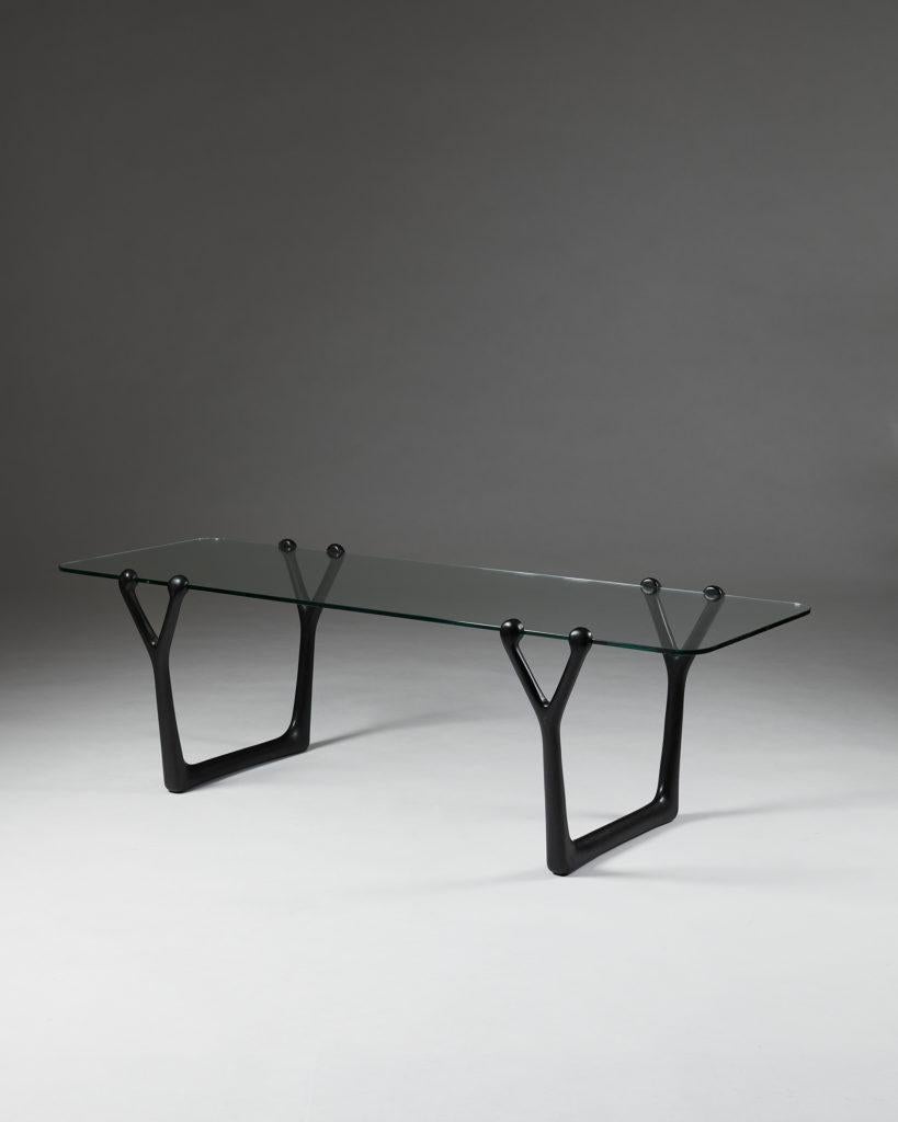 Occasional table designed by Helge Vestergaard Jensen,
Denmark, 1954.

Unique. Manufactured by Thysen Nielsen.

Ebonised wood and original clear glass.

Exhibited at the Cabinet Maker's Guild Exhibition in Copenhagen, 1954.

Provenance: From a