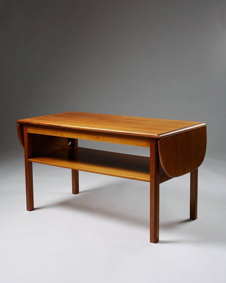 Occasional table designed by Josef Frank for Svenskt Tenn, 
Sweden, 1950s.

Mahogany.

Measurements: 
H: 60 cm/ 23 1/2''
Length when extened: 104 cm/ 3' 5''
D: 54 cm/ 21 1/2''
 
Josef Frank was a true European, he was also a pioneer of what would