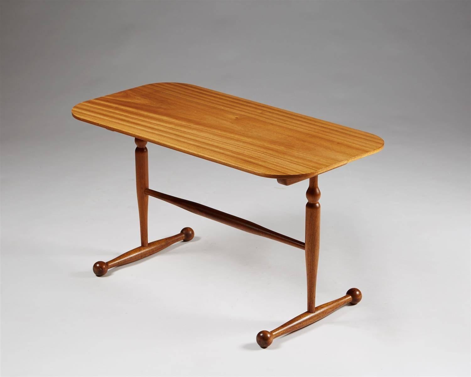 Occasional table designed by Josef Frank for Svenskt Tenn,
Sweden. 1950s.

Mahogany.

H: 45 cm
L: 80 cm
D: 40 cm

Josef Frank was a true European, he was also a pioneer of what would become classic 20th century Swedish design and the “Scandinavian