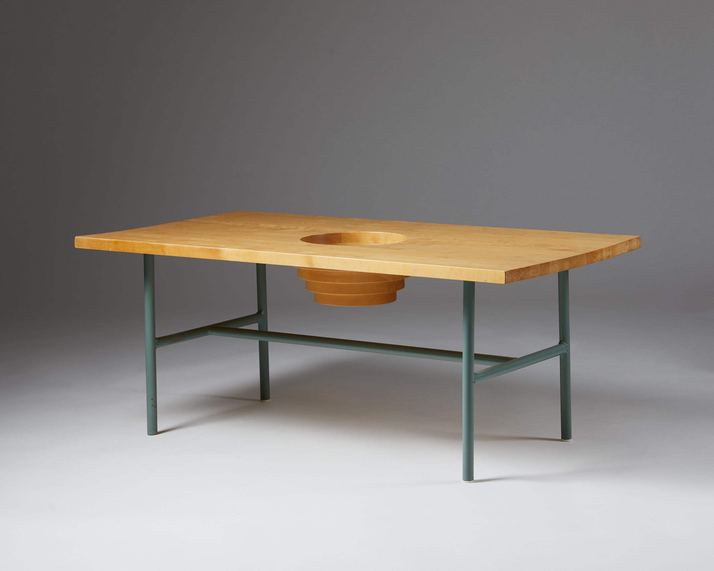 Occasional table designed by Thomas Sandell for Asplund,
Sweden, 1990s.

Birch and lacquered tubular steel.

Dimensions: 
H: 49 cm / 1' 7 1/4