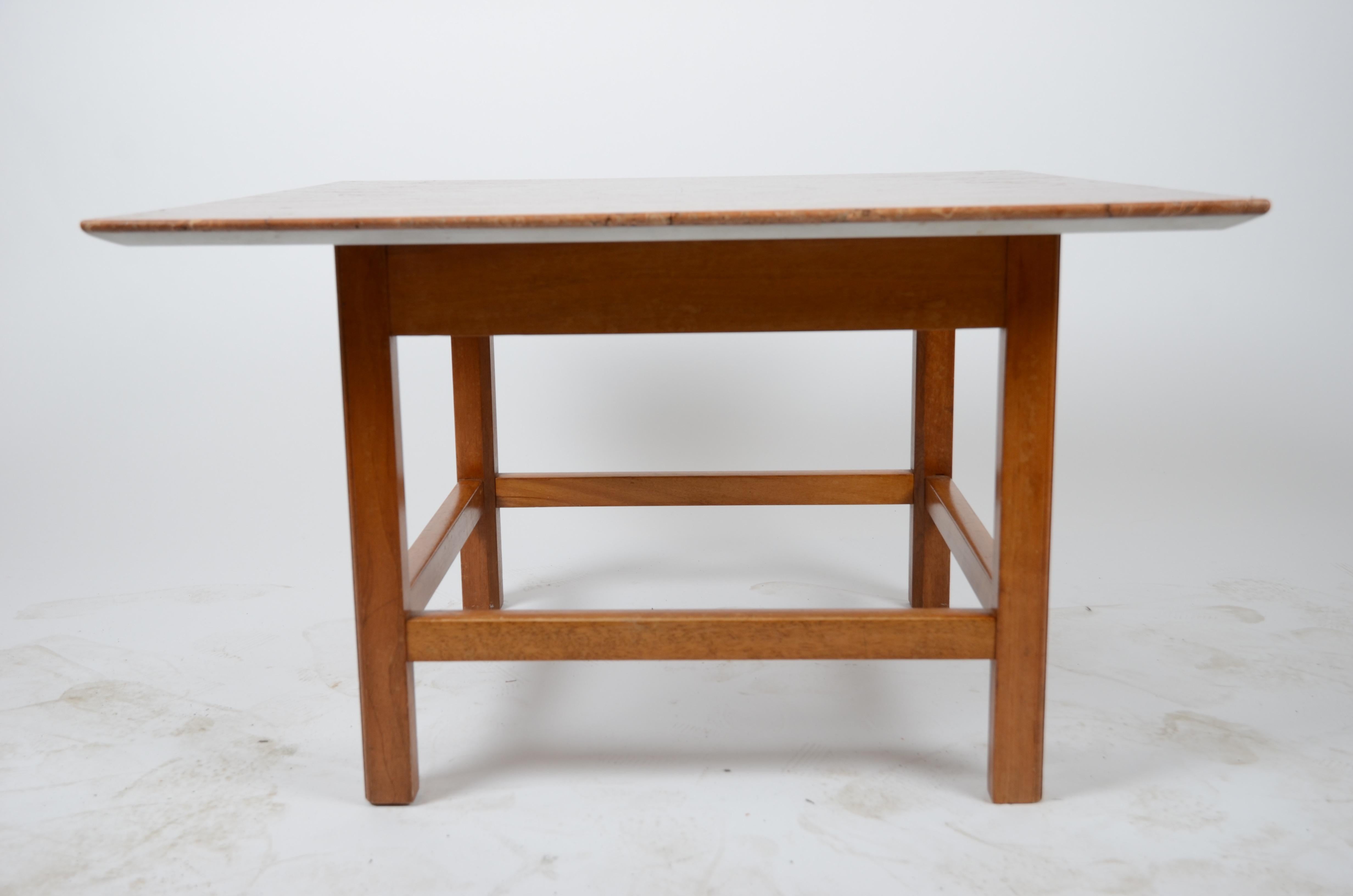 An occasional table with marble top. Designed by Josef Frank for Firma Svenskt Tenn, 1940s-1950s.