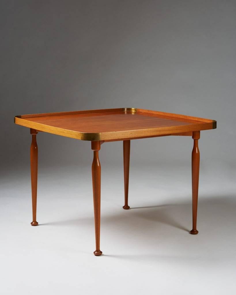 Occasional table model 1074 designed by Josef Frank for Svenskt Tenn,
Sweden, 1950s.

Mahogany and brass.