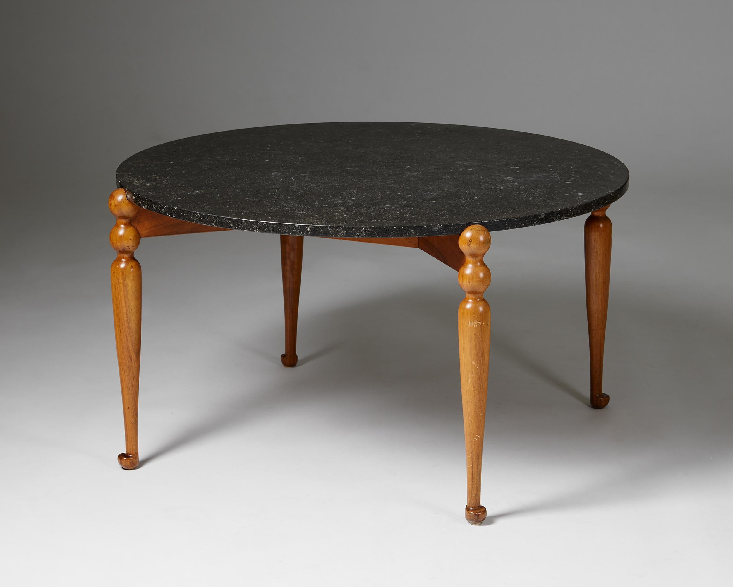 Occasional table model 2168 designed by Josef Frank for Svenskt Tenn,
Sweden. 1950s.

Walnut and marble.

Josef Frank’s occasional table “model 2168” is one of his rarer models. Its beautifully carved, turned legs give it a lighter and more playful
