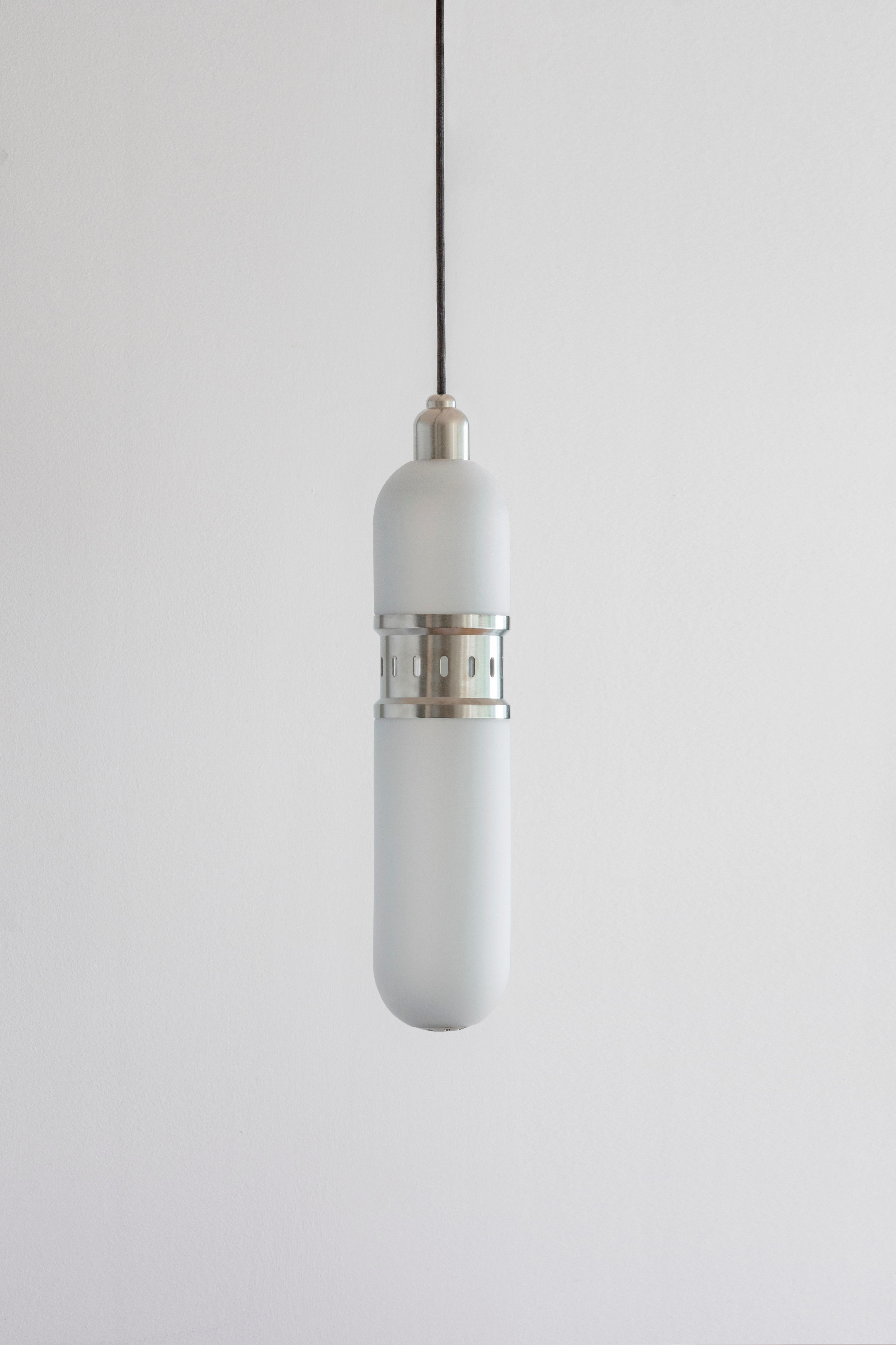Occulo nickel pendant lamp by Bert Frank
Dimensions: 35 x H 46 cm 
Materials: nickel, glass
Available in brushed brass, dark bronze or satin nickel.

All our lamps can be wired according to each country. If sold to the USA it will be wired for