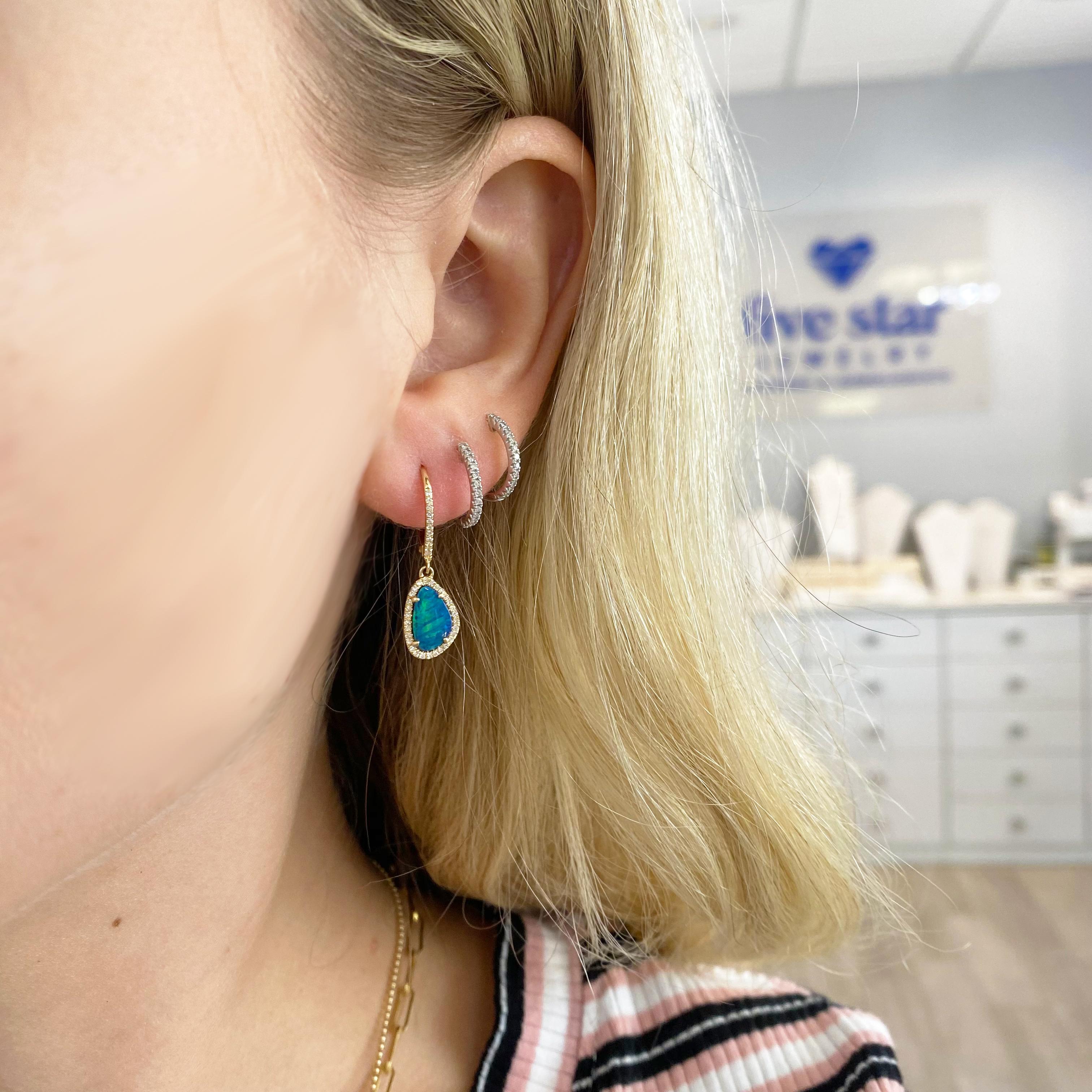 Blue, blue opals look like the ocean with hint of green! These earrings are going to POP when you wear them. Bright blue opals will shine bright with long or short hair! These opal favorites have diamonds surrounding the organic shape and diamonds