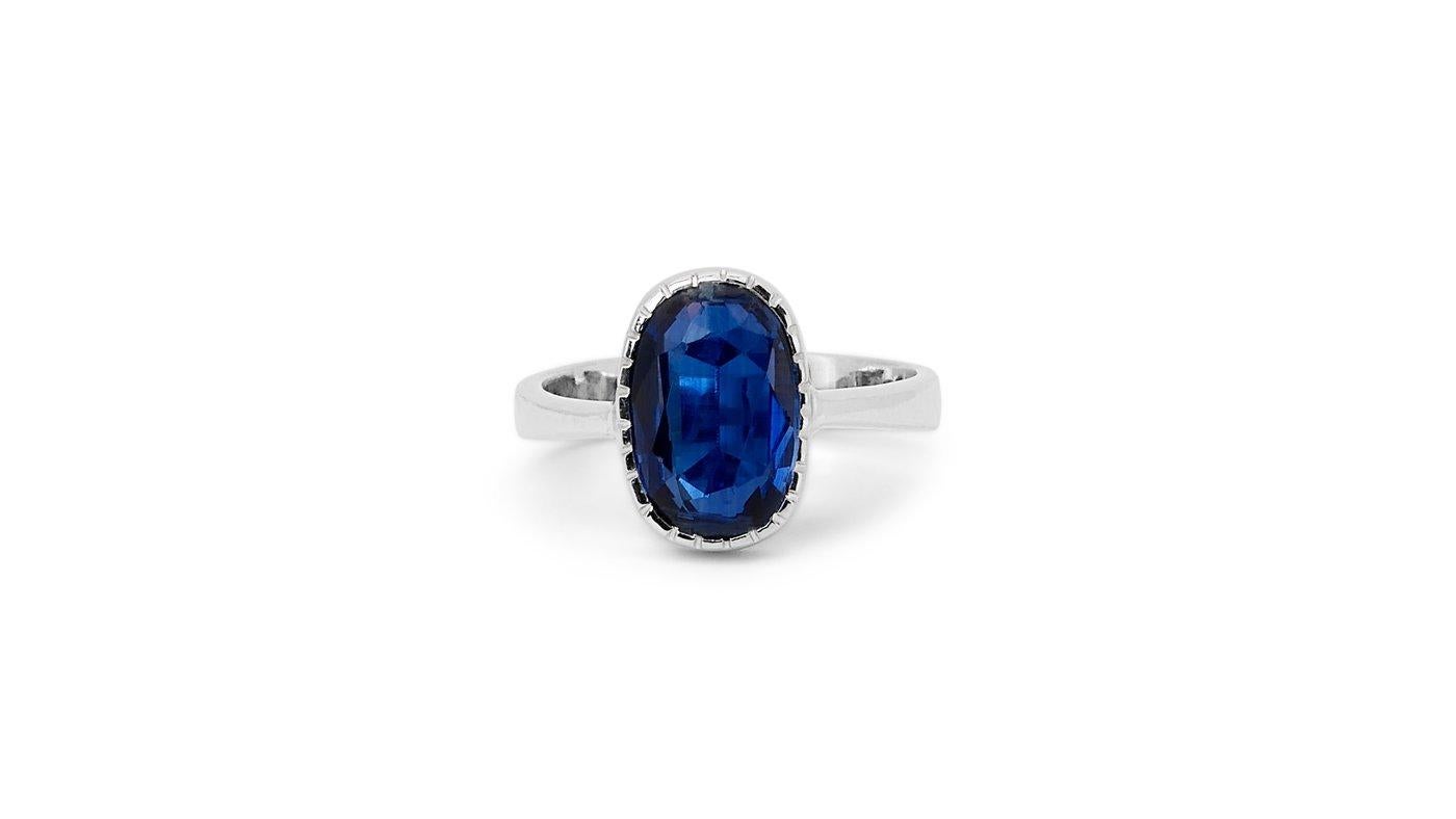 A beautiful classic solitaire ring with a dazzling 2.4 carat with an unbelievable oval mixed cut sapphire with deep ocean blue color. The jewelry is made of 14K white gold with a high-quality polish. It comes with an IGI certificate and a fancy