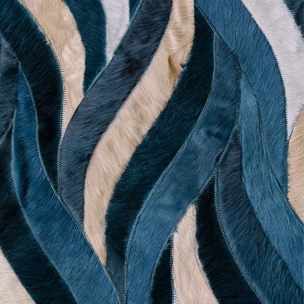 Introducing the Onda Rug in Blue, a mesmerizing rug that will transport you straight to the beachside. With its coastal-inspired design with a teal, blue and sand color palette, this masterpiece effortlessly brings a touch of coastal living into