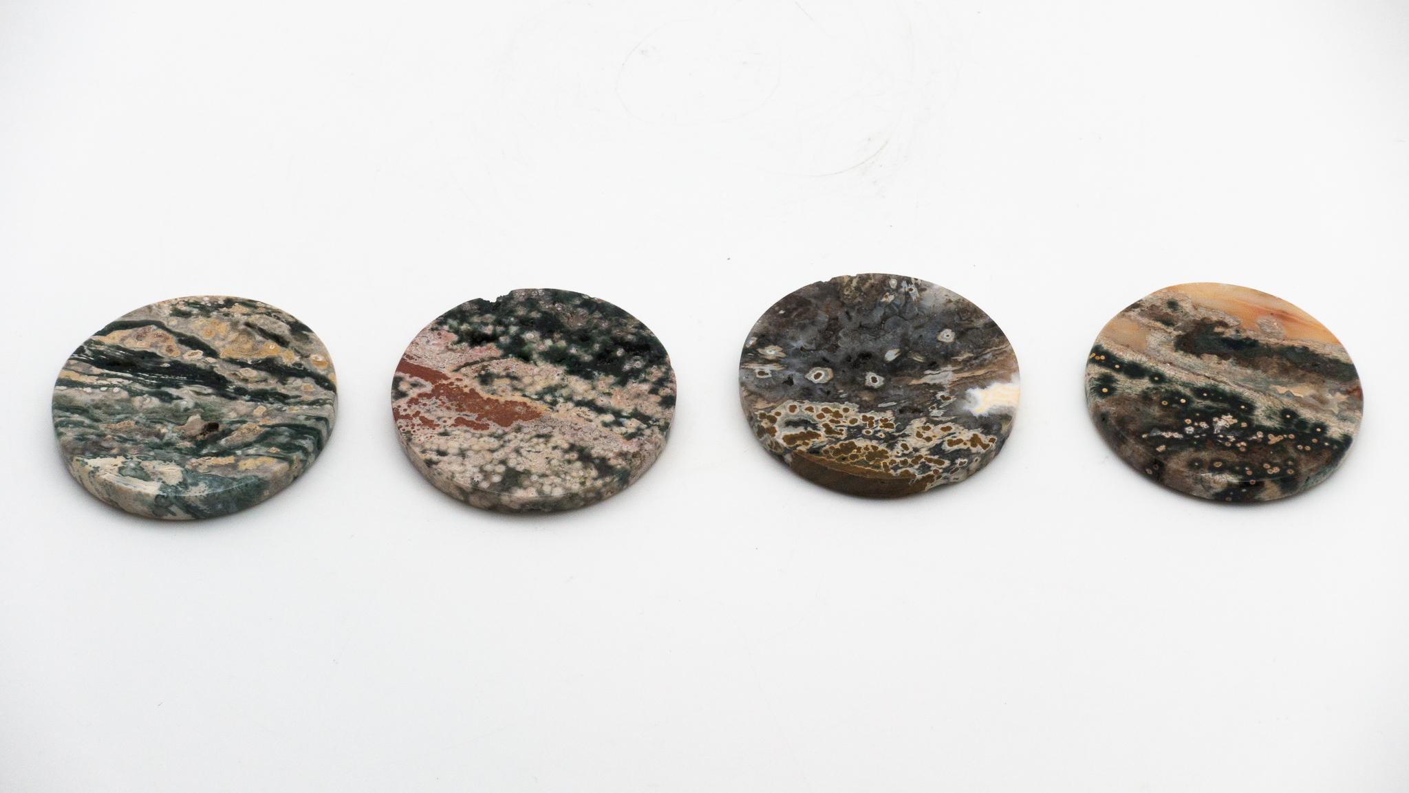 Set of four ocean jasper beverage coasters. Ocean jasper, or snakeskin jasper, is a combination of chalcedony, microcrystalline quartz and other minerals, resulting in colorful bands and patterns.