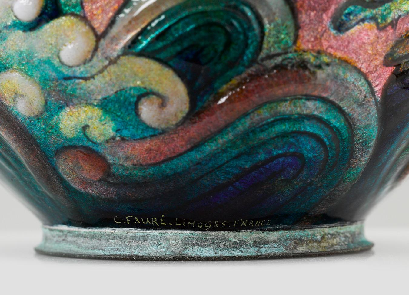 Waves of enamel in shades of blue, green and pink wash over this vase by the renowned Camille Fauré. Utilizing his signature technique, the vase's petite copper form is covered with layer upon layer of vibrant enamel creating a 