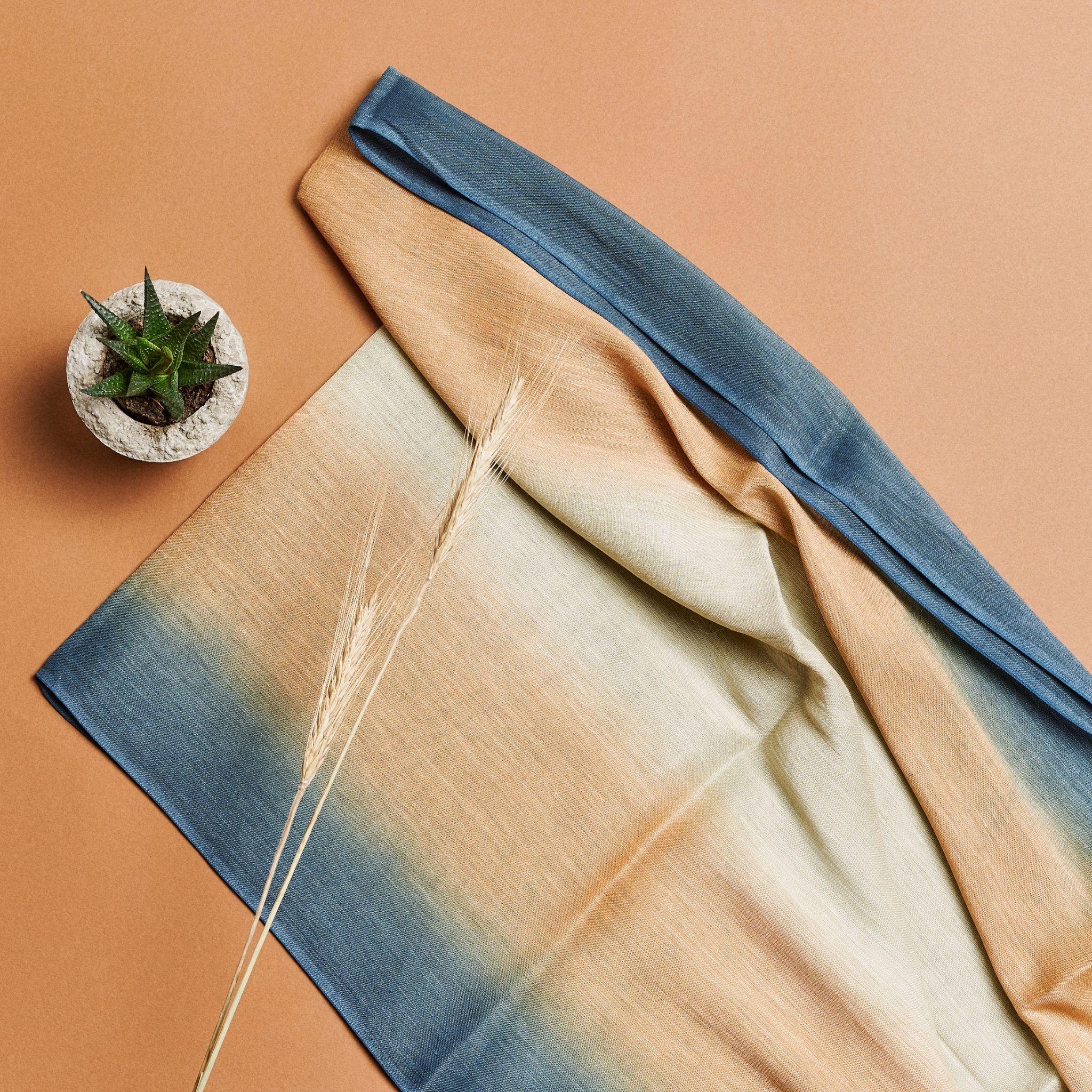 Soft in hand feel this classic scarf has been hand dyed in ombre effect to give it a soothing look that also makes it a unisex piece. This scarf can be worn all year around, suitable for travel, freezing offices or a full day drape that can be