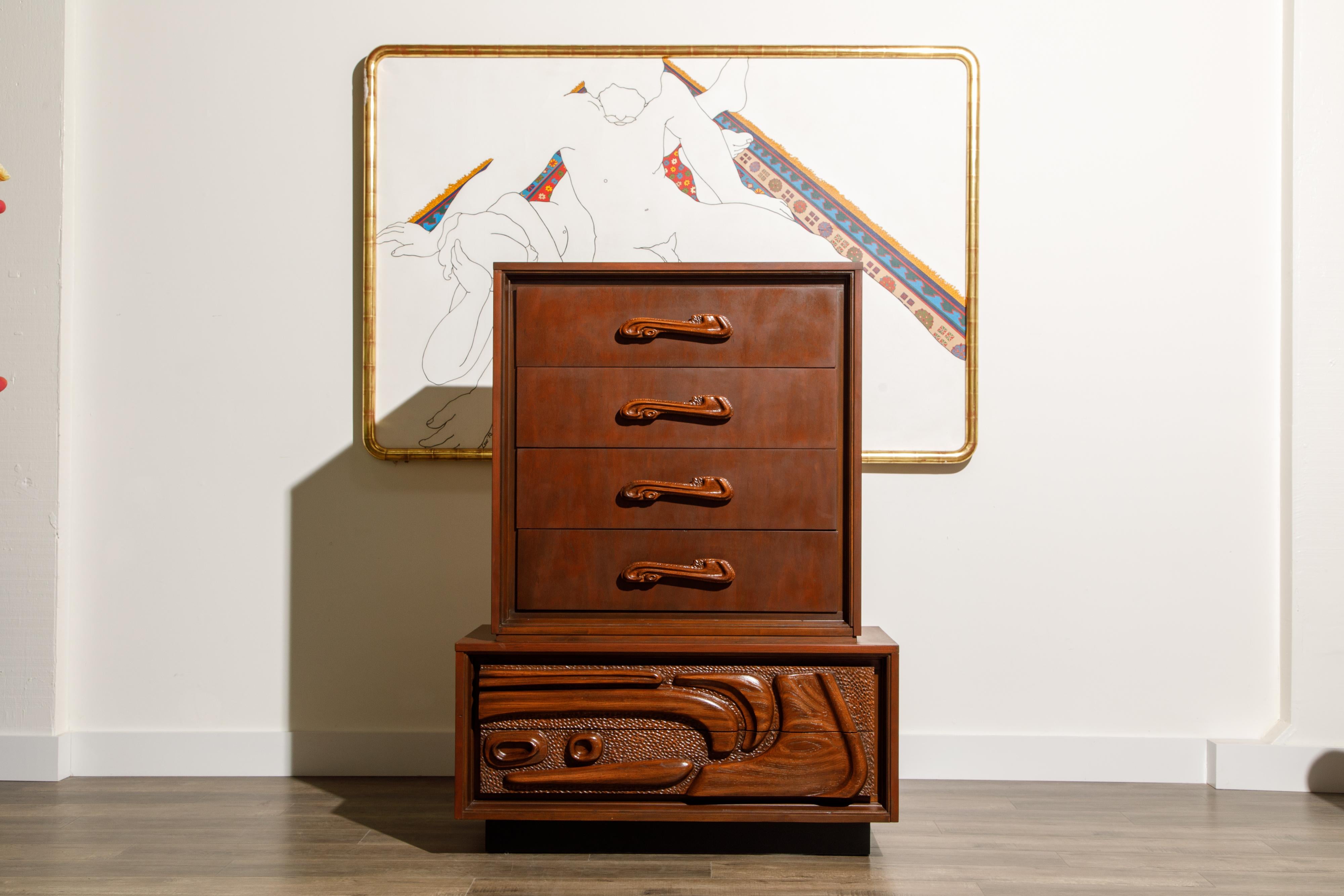 This fantastic lacquered sculpted walnut 'Oceanic' highboy dresser cabinet by Pulaski Furniture Corporation, circa 1969 which perfectly encapsulates the California surf mentality of the 1960s and 1970s, making this piece a highly sought after design