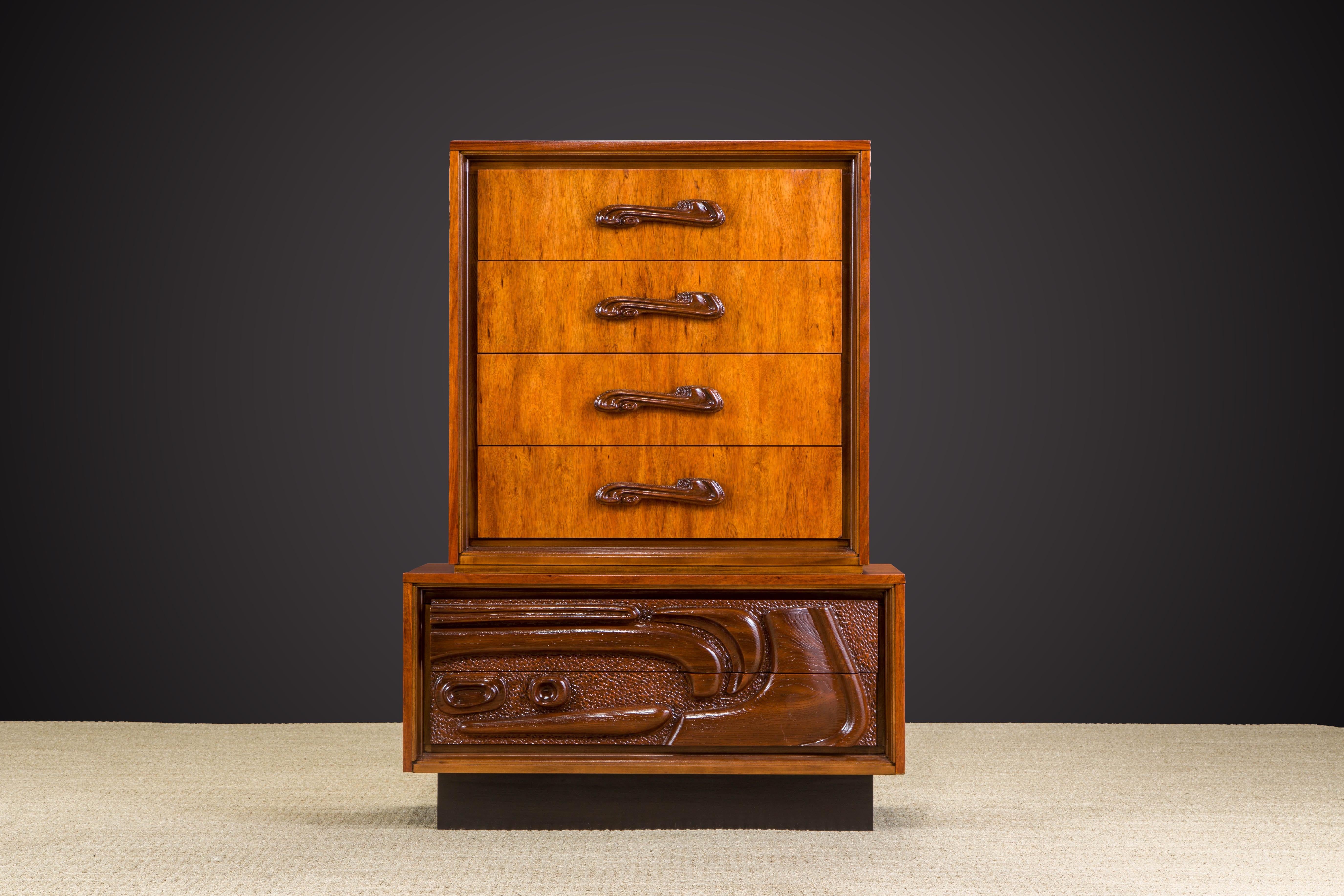 This fantastic lacquered sculpted walnut 'Oceanic' highboy dresser cabinet by Pulaski Furniture Corporation, circa 1969 which perfectly encapsulates the California surf mentality of the 1960s and 1970s, making this piece a highly sought after design