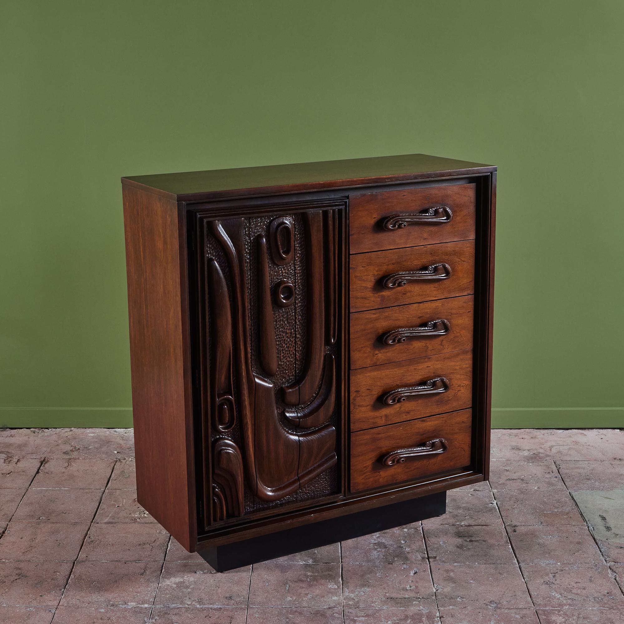 Tall dresser for Pulaski Furniture, c.1960s, USA. The walnut dresser features uniquely sculpted cabinet pulls, reminiscent of waves. One side of the dresser showcases five drawers while the other side has a similarly sculpted cabinet door front,