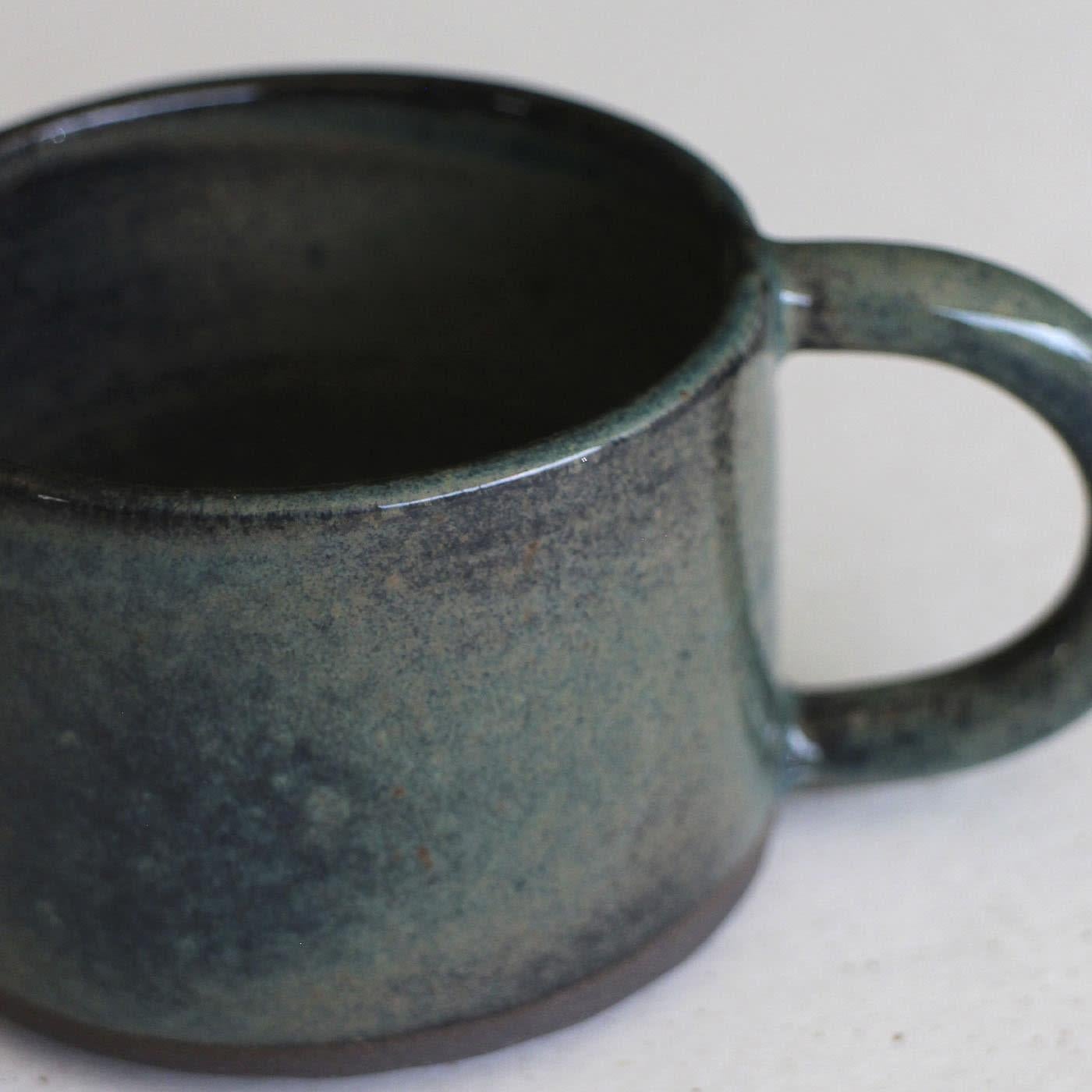 This one-of-a-kind stoneware set of 4 espresso cups with coordinated saucers celebrates the dreamy tones of blue, purple, and green ocean offers. Its evocative lead-free and non-toxic glaze flaunts a glossy finish that further emphasizes very unique