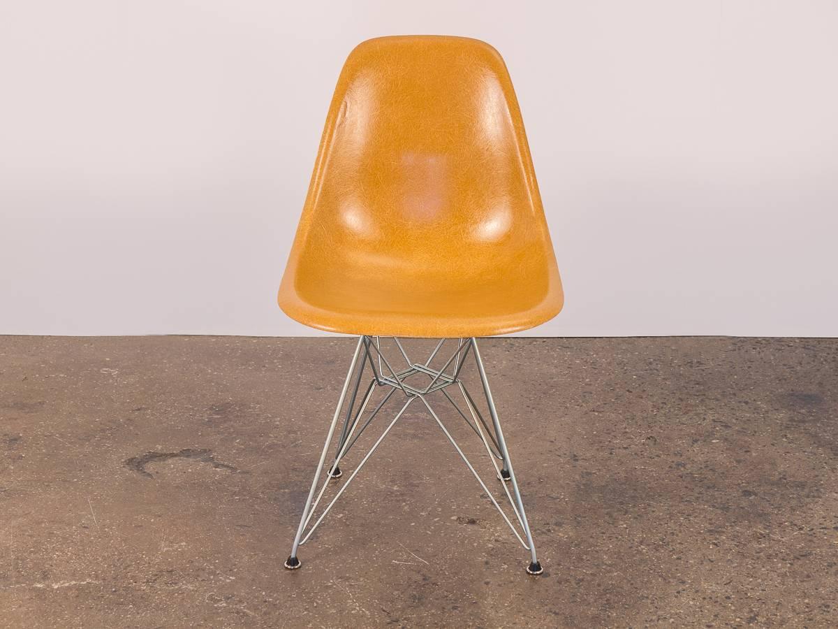 Very scarce, ochre fiberglass shell chair by Charles and Ray Eames for Herman Miller. Only one available. Our distinctly thready 1960s shell has a earthy ochre hue that is hard to come by. Shell is in beautiful vintage condition, with minimal