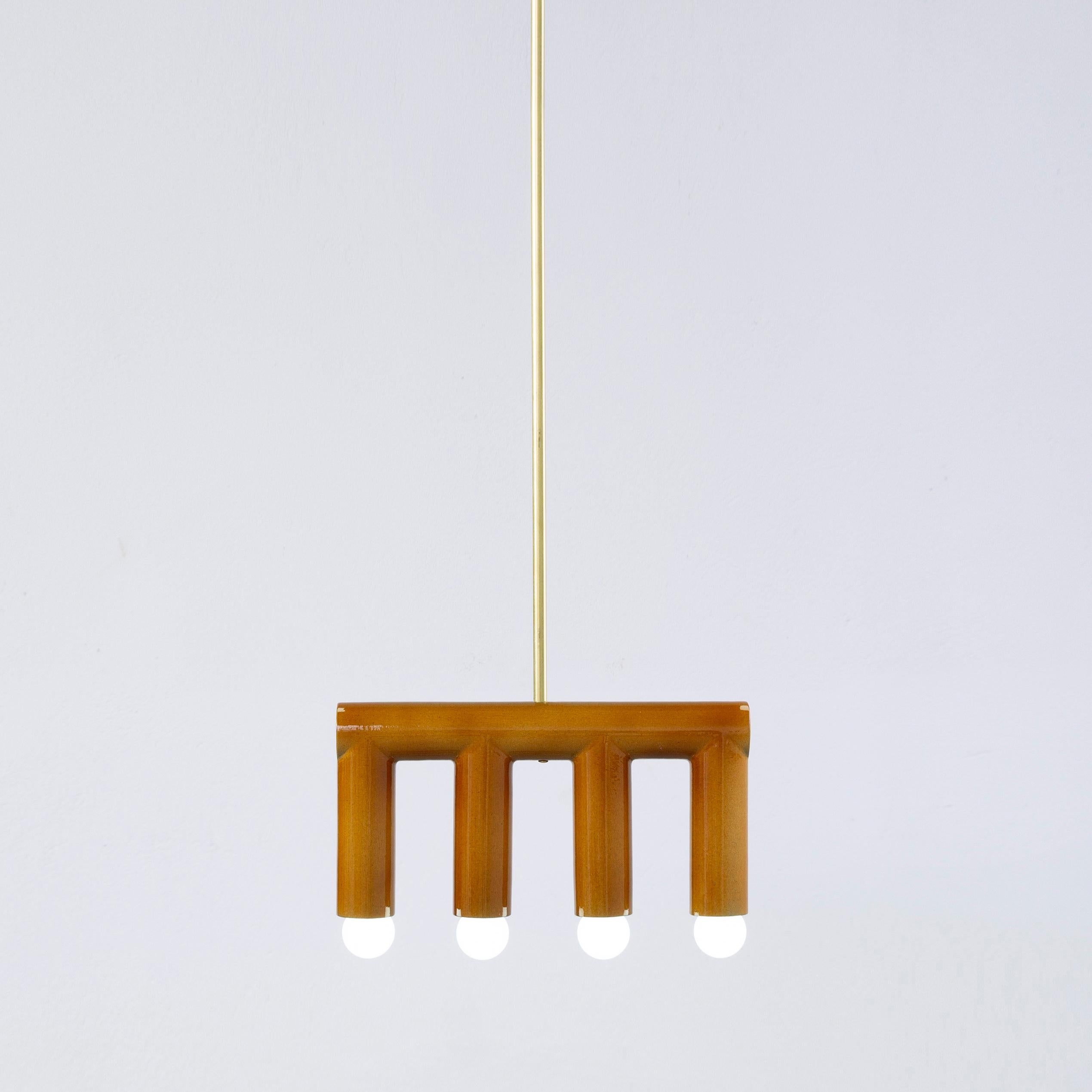 Ochre TRN B3 pendant lamp by Pani Jurek
Dimensions: D 5 x W 35 x H 18 cm 
Material: Hand glazed ceramic and brass.
Available in other colors.
Lamps from the TRN collection hang on a metal tube, not on a cable. This allows the lamp to be mounted in a