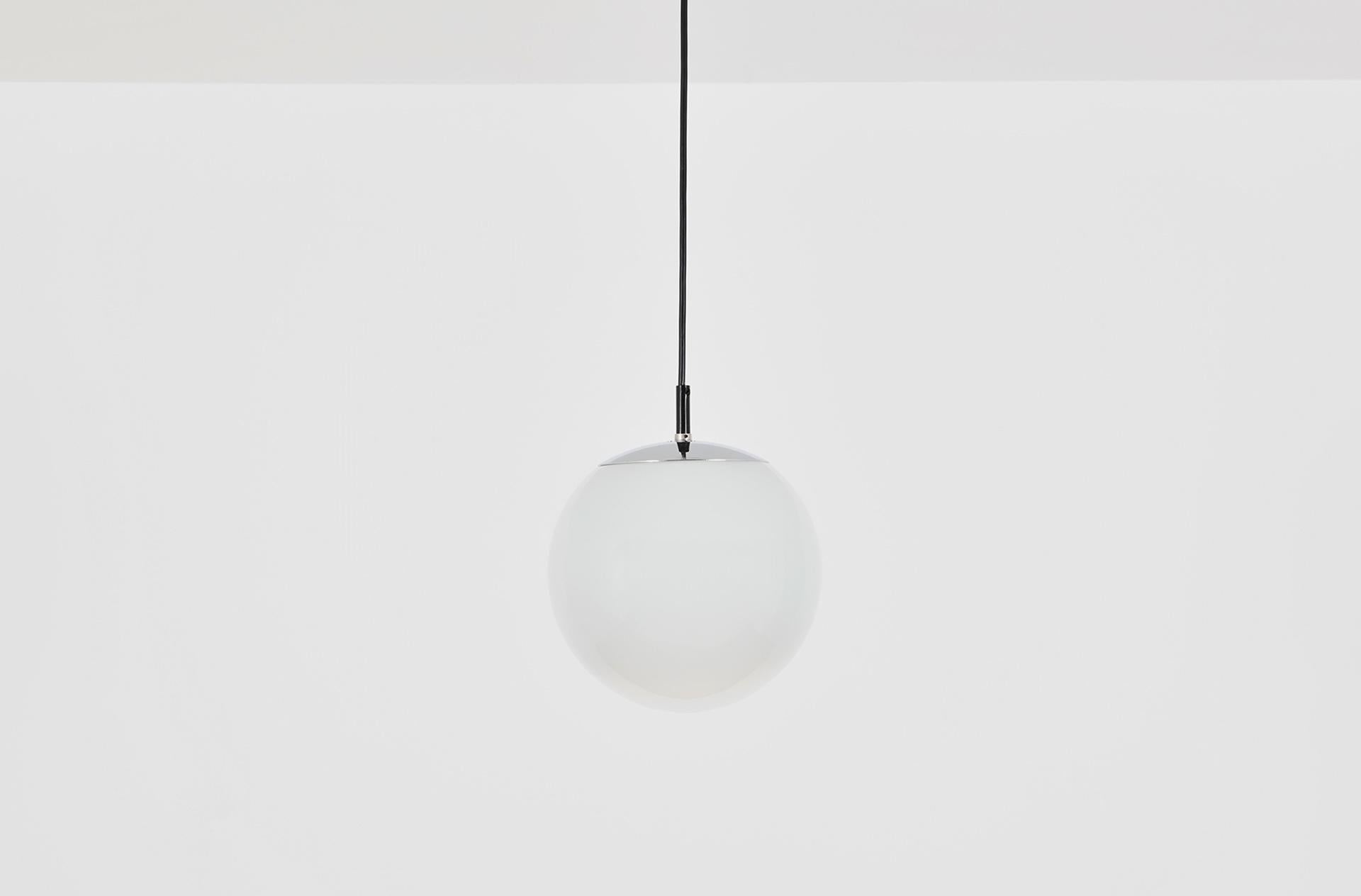 Opaque glass with gradient finish, chrome suspension. Small size. 

Multiple items also available in medium and large size. 
 
This misty white globe, in quality glass from Peill & Putzler, was manufactered by Raak in the early 70's. The Morning