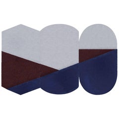 Oci Triptyque S, composition de 3 tapis 100 % laine/bleu et brique par Portego