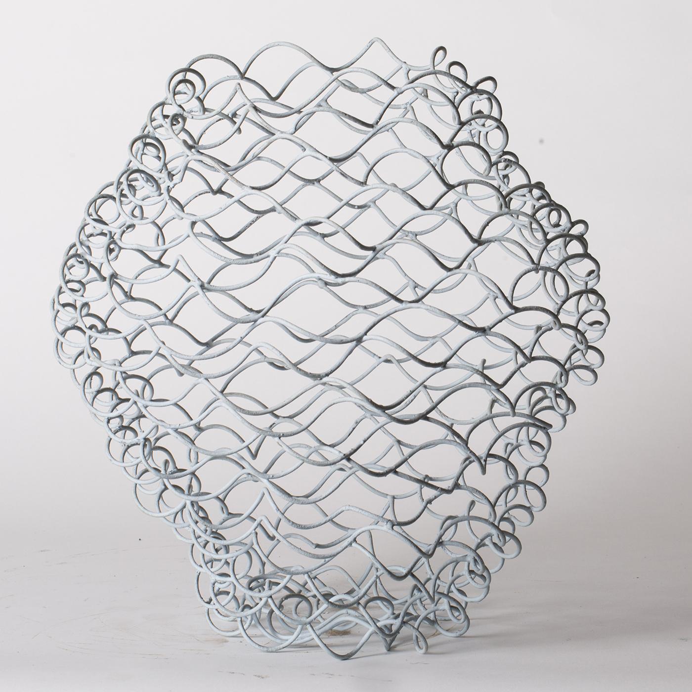 This abstract vase by Sciortino is formed of tempered iron wire and has a painted finish in varying shades of light blue. Product dimensions may vary slightly.