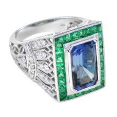 Anillo de oro blanco de 18 quilates estilo art déco de tanzanita azul octógono y esmeralda y diamantes