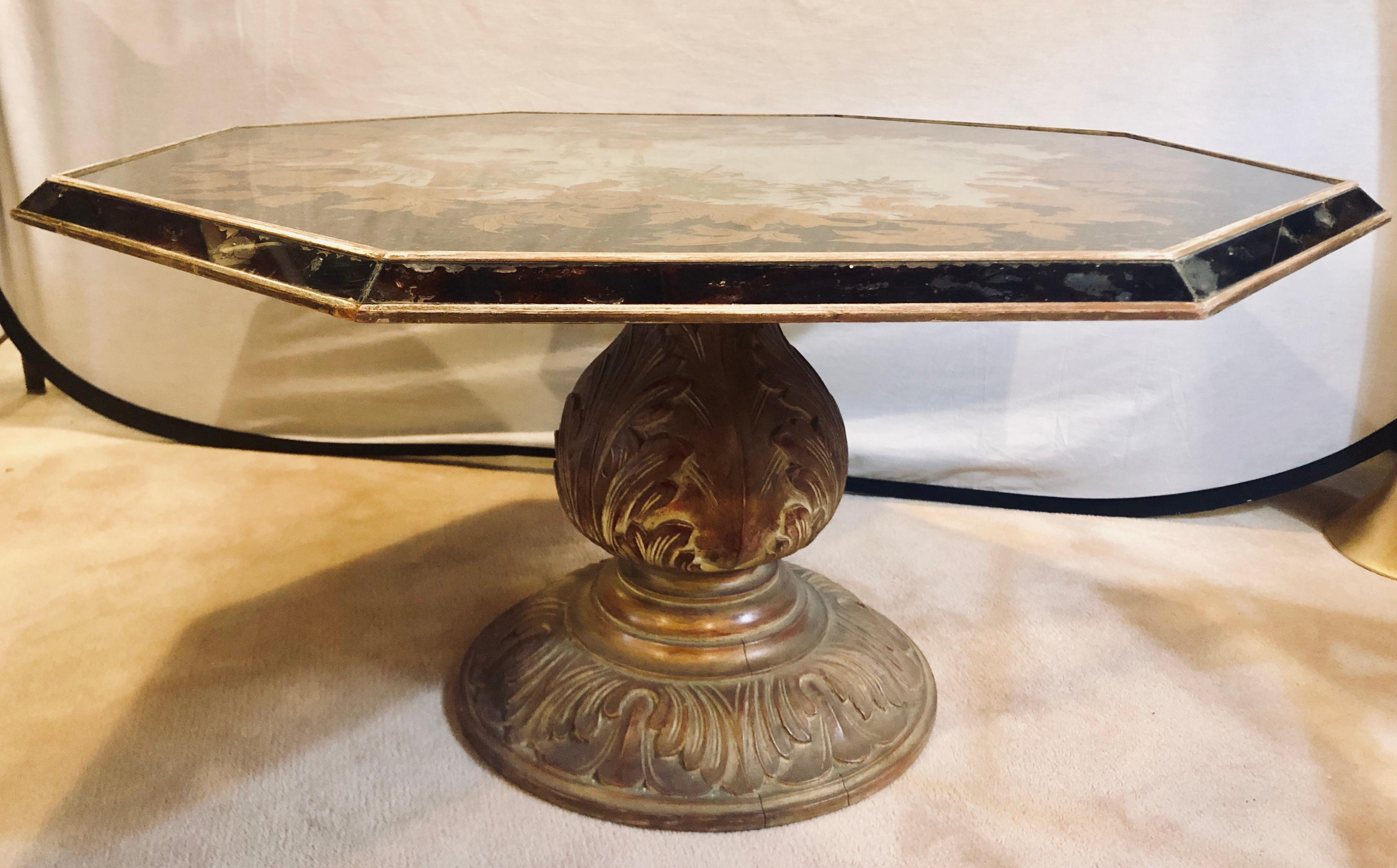 Octagon chinoiserie decorated mirror top low coffee table with carved wood base.