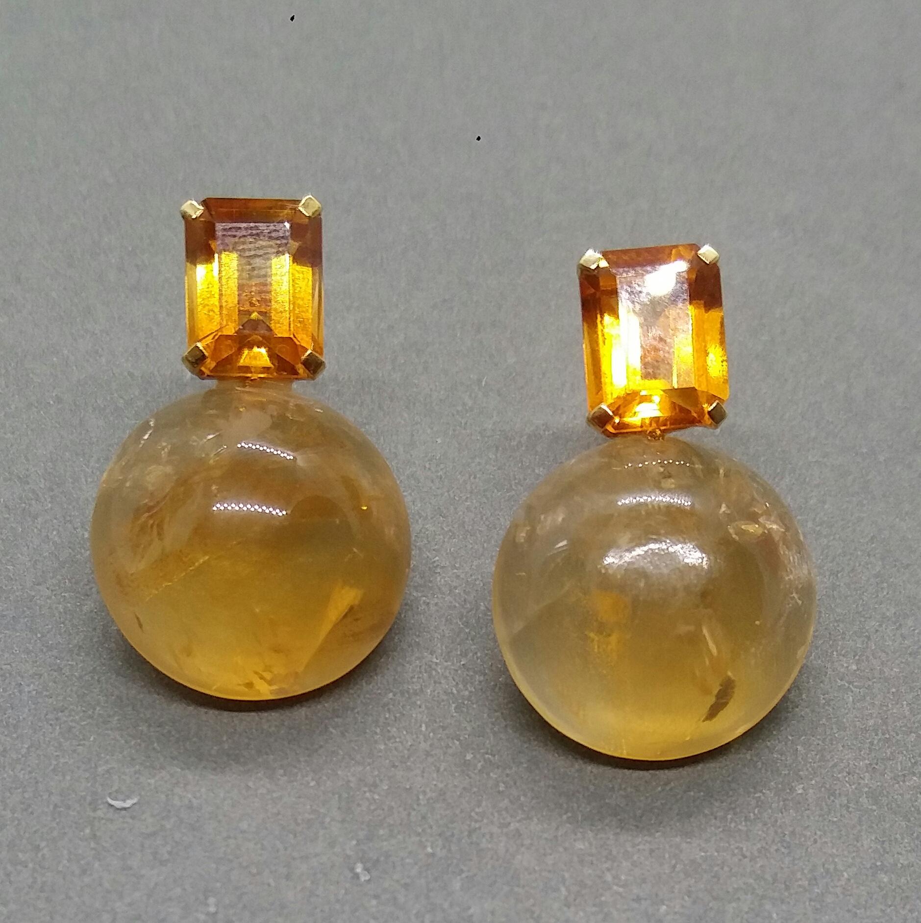 These simple but elegant and unique earrings have 2 faceted Octagon shape Cognac Citrines set in yellow gold at the top to which are suspended 2 Golden Citrine plain round buttons  size 17 mm in diameter

In 1978 our workshop started in Italy to