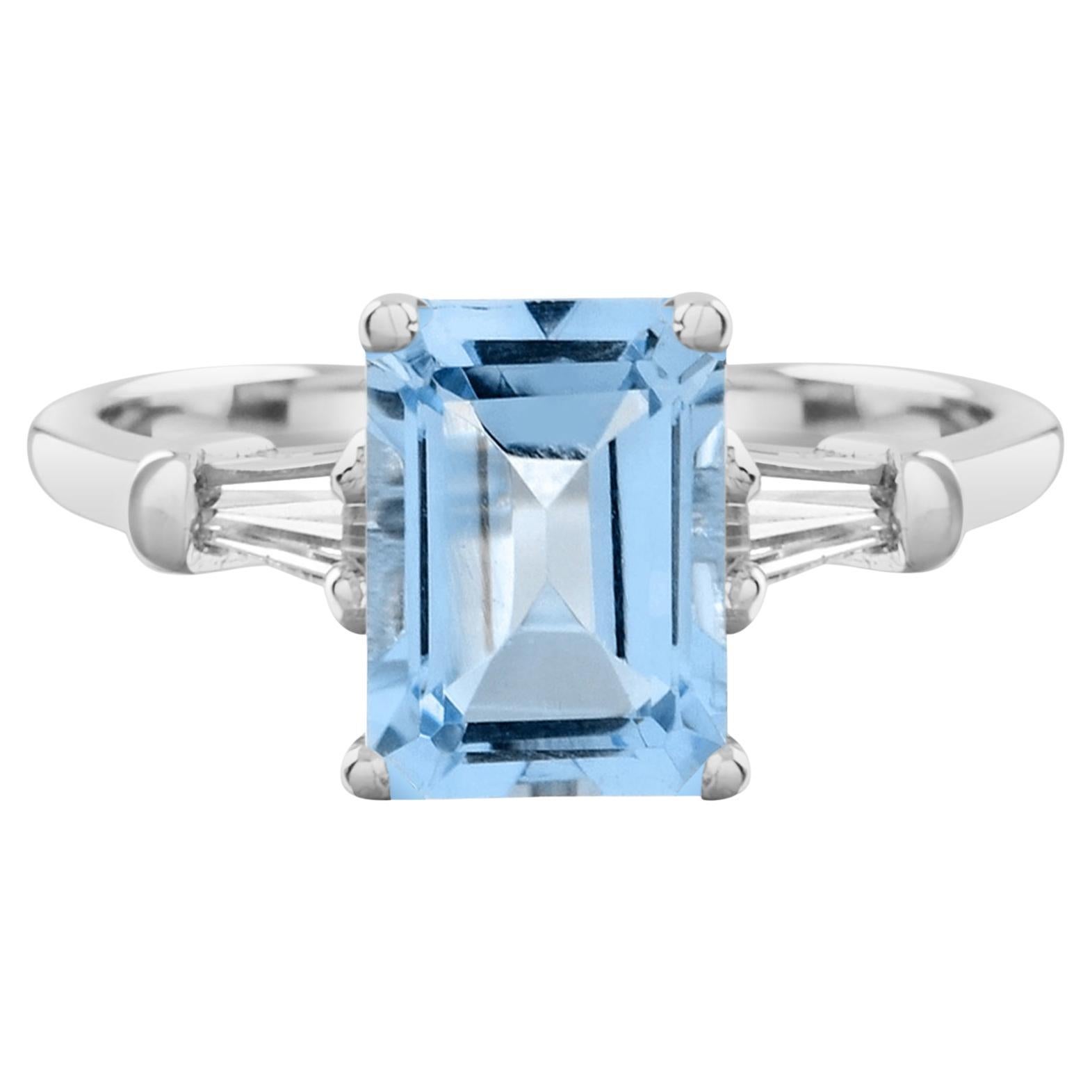 Bague solitaire en or blanc 14K avec topaze bleue octogonale taille émeraude et diamant baguette