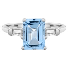Anello con Topazio Blu Taglio Smeraldo Ottagonale e Diamante Baguette Solitario in Oro Bianco 14K