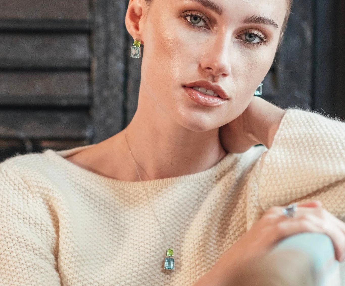 These vivacious 9ct yellow gold gemstone earrings from the Andalusian Collection feature two exquisite octagon cut stones: bright green peridot with sparkling sky blue topaz, inspired by the flourishing foliage and azure skies of southern