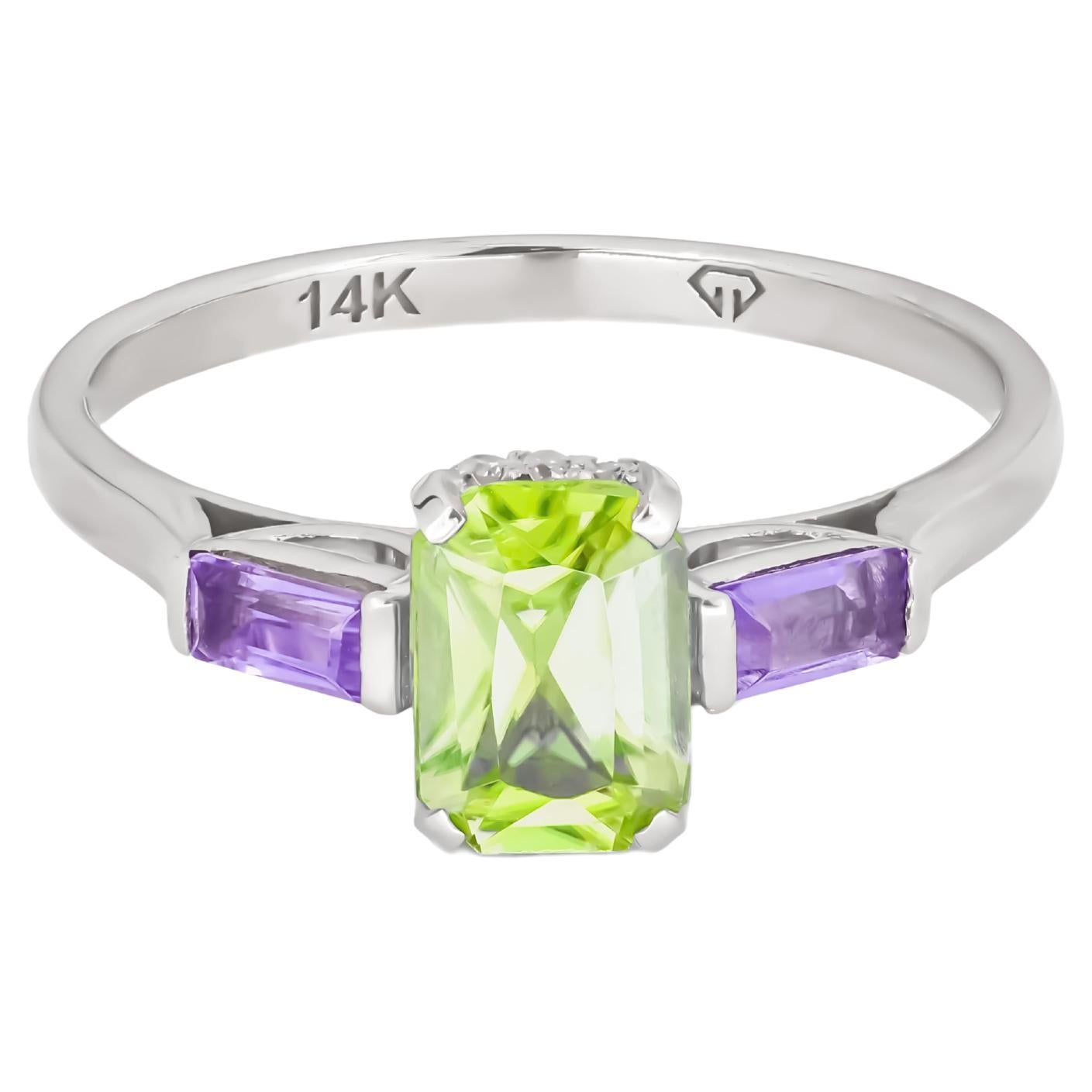Octagon peridot 14k gold ring.