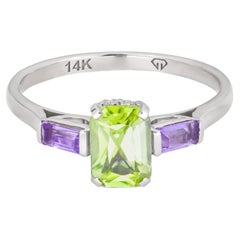 Octagon peridot 14k gold ring.