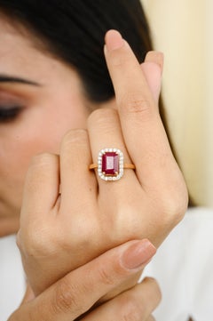 Deep Red Ruby Halo Diamond Engagement Ring in Solid 18 Karat Yellow Gold