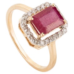 Deep Red Ruby Halo Diamond Engagement Ring in Solid 18 Karat Yellow Gold